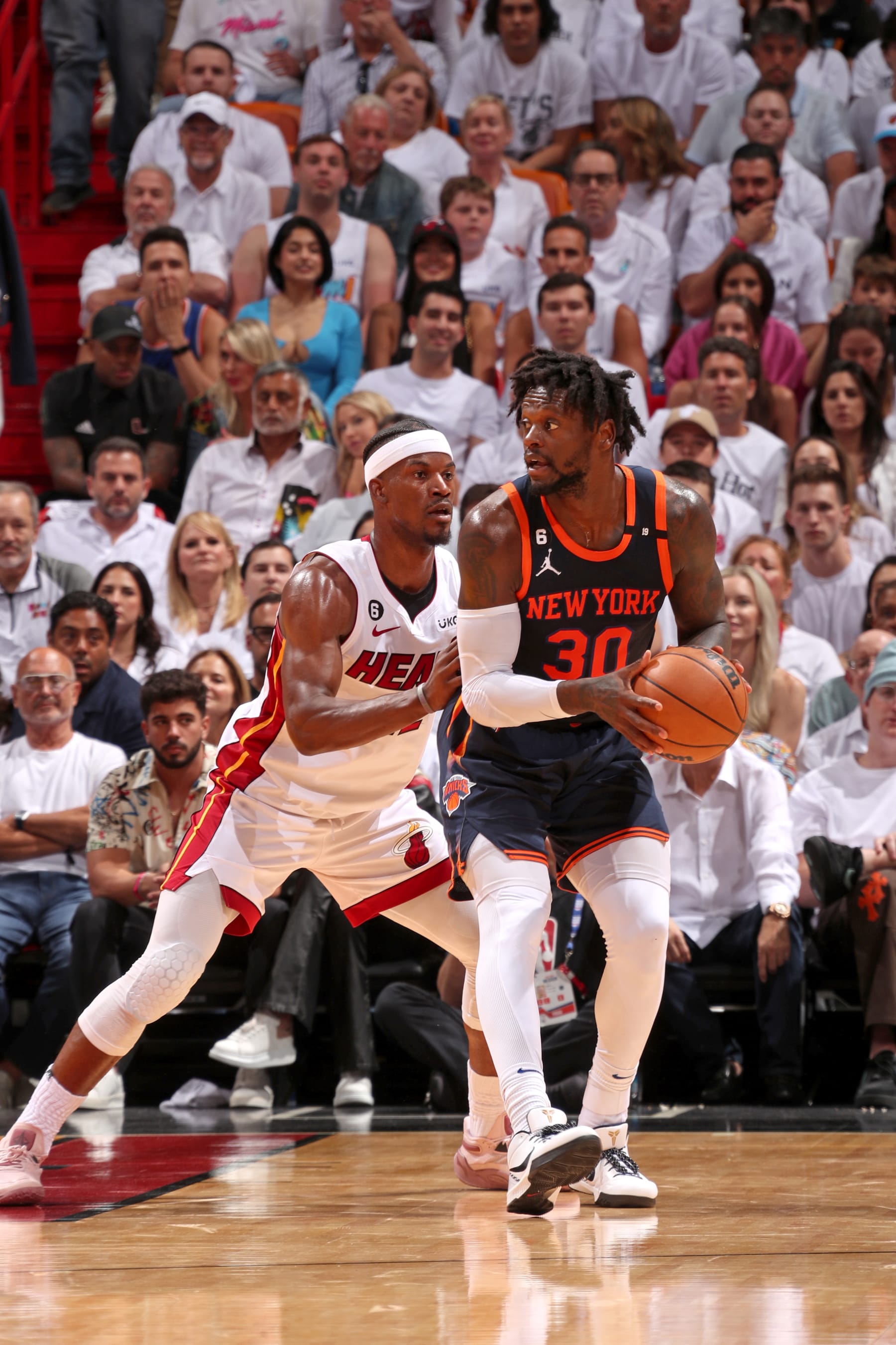MIAMI, FL - MAY 12:  Julius Randle #30 of the New York Knicks handles the ball against Jimmy Butler #22 of the Miami Heat during Game 6 of the 2023 NBA Playoffs Eastern Conference Semi-Finals on May 12, 2023 at Kaseya Center in Miami, Florida. NOTE TO USER: User expressly acknowledges and agrees that, by downloading and or using this Photograph, user is consenting to the terms and conditions of the Getty Images License Agreement. Mandatory Copyright Notice: Copyright 2023 NBAE (Photo by Issac Baldizon/NBAE via Getty Images)