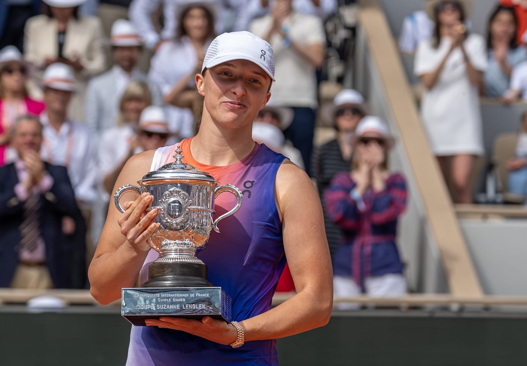 PARIS, FRANCE - JUNE 08: Iga Swiatek of Poland holds the Womens Singles Trophy after defeating Jasmine Paolini of Italy for the title on Day 14 of Roland Garros 2024 (Fred Mullane/ISI Photos)