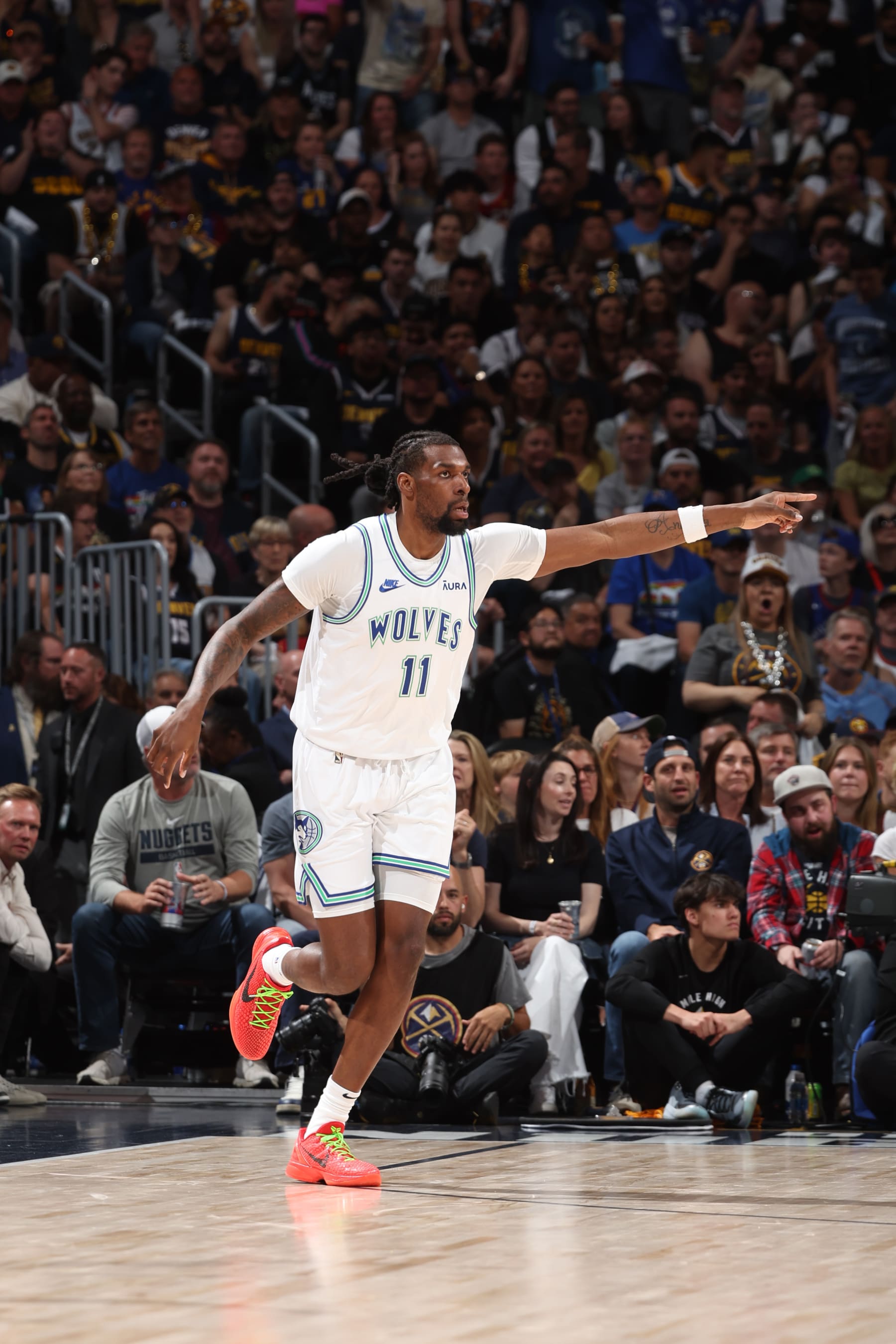 DENVER, CO - MAY 19: Naz Reid #11 of the Minnesota Timberwolves celebrates during the game  against the Minnesota Timberwolves during Round 2 Game 7 of the 2024 NBA Playoffs on May 19, 2024 at the Ball Arena in Denver, Colorado. NOTE TO USER: User expressly acknowledges and agrees that, by downloading and/or using this Photograph, user is consenting to the terms and conditions of the Getty Images License Agreement. Mandatory Copyright Notice: Copyright 2023 NBAE (Photo by David Sherman/NBAE via Getty Images)