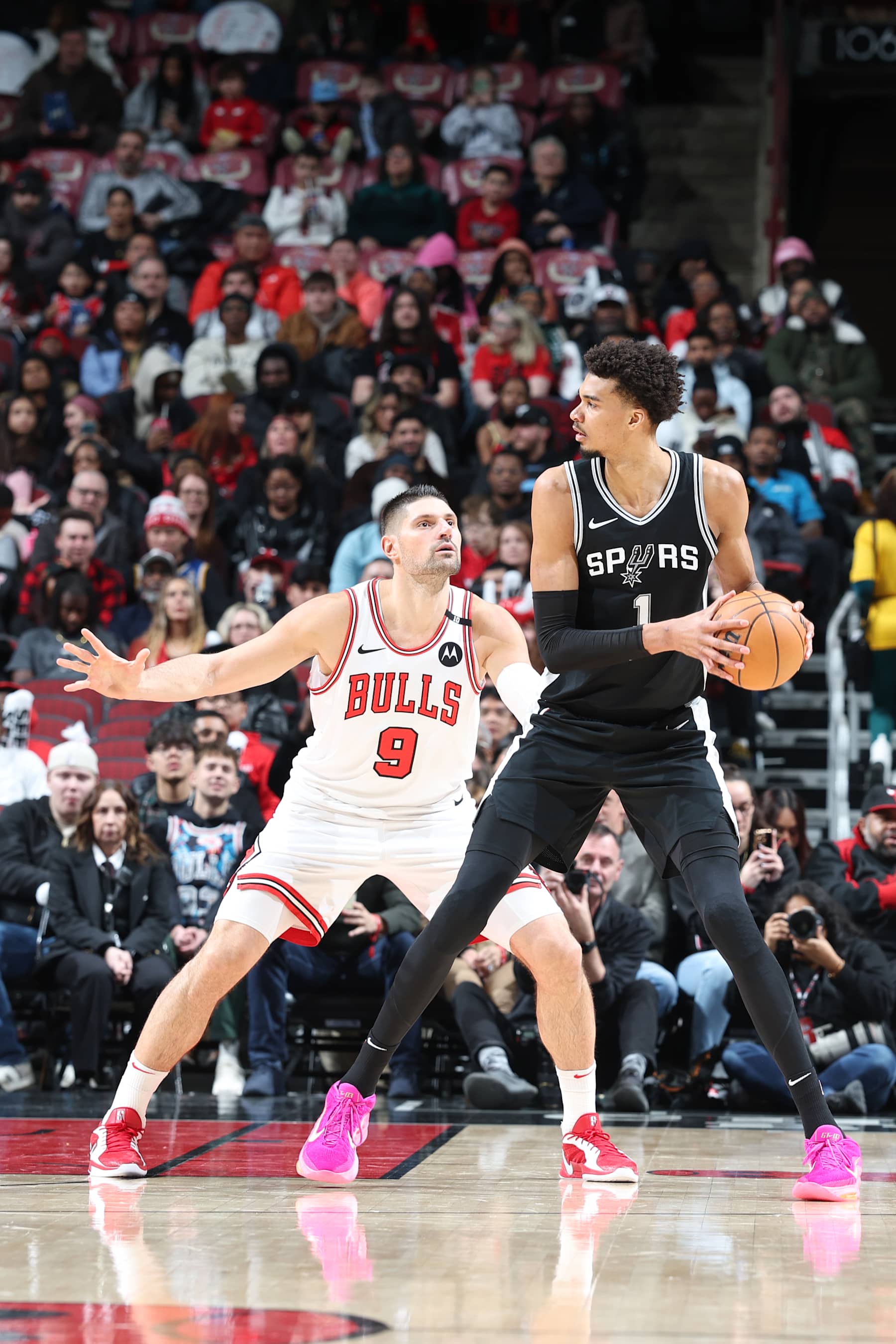 CHICAGO, IL - JANUARY 6:  Nikola Vucevic #9 of the Chicago Bulls plays defense during the game against Victor Wembanyama #1 of the San Antonio Spurs on January 6, 2025 at United Center in Chicago, Illinois. NOTE TO USER: User expressly acknowledges and agrees that, by downloading and or using this photograph, User is consenting to the terms and conditions of the Getty Images License Agreement. Mandatory Copyright Notice: Copyright 2025 NBAE (Photo by Jeff Haynes/NBAE via Getty Images)