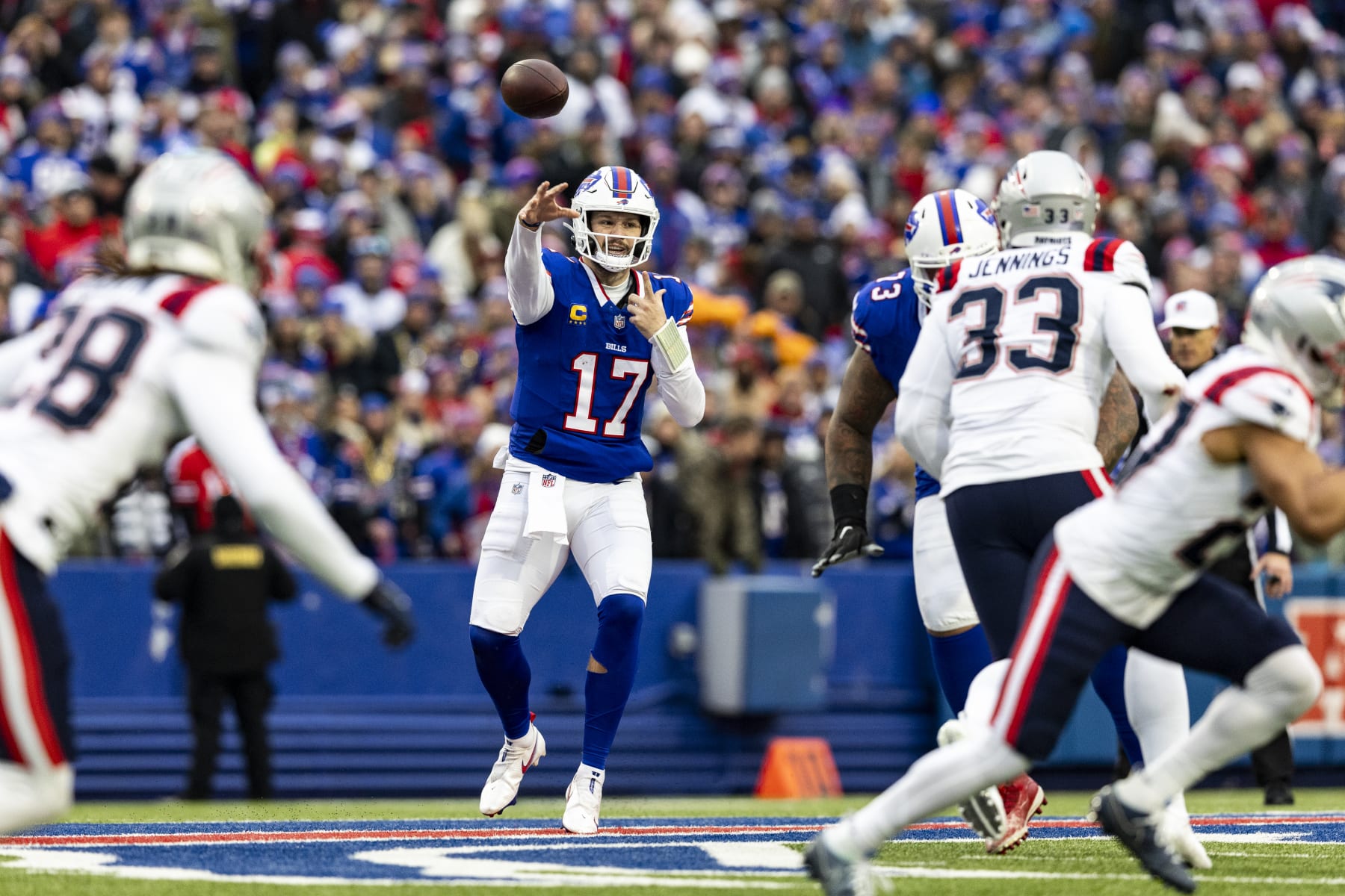BUFFALO, NEW YORK - DECEMBER 31: Josh Allen #17 of the Buffalo Bills throws a pass during the game against the New England Patriots at Highmark Stadium on December 31, 2023 in Buffalo, New York. The Bills beat the Patriots 27-21. (Photo by Lauren Leigh Bacho/Getty Images)