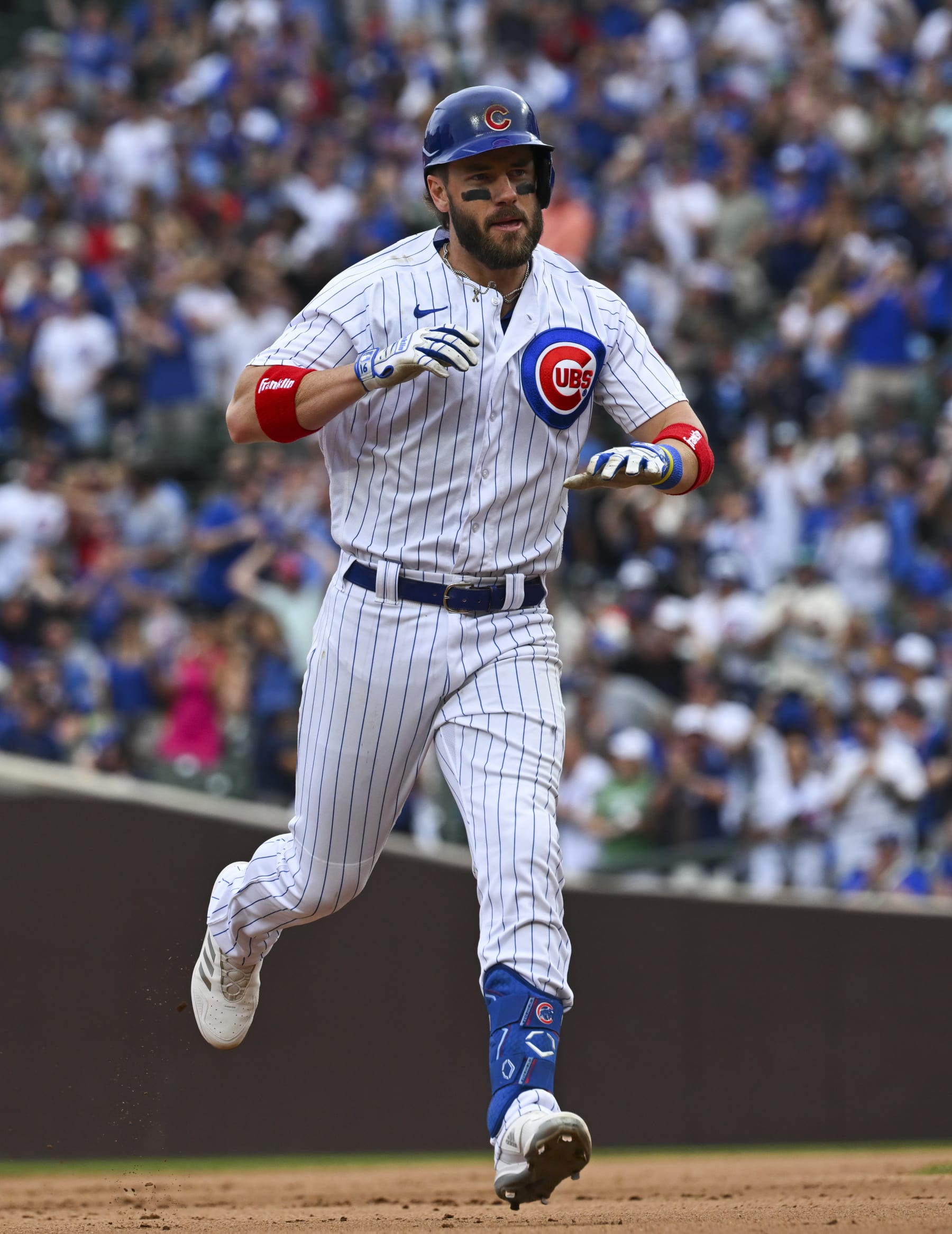 CHICAGO, ILLINOIS - SEPTEMBER 24: Patrick Wisdom #16 of the Chicago Cubs celebrates a two run home run against the Colorado Rockies at Wrigley Field on September 24, 2023 in Chicago, Illinois. (Photo by Nuccio DiNuzzo/Getty Images)