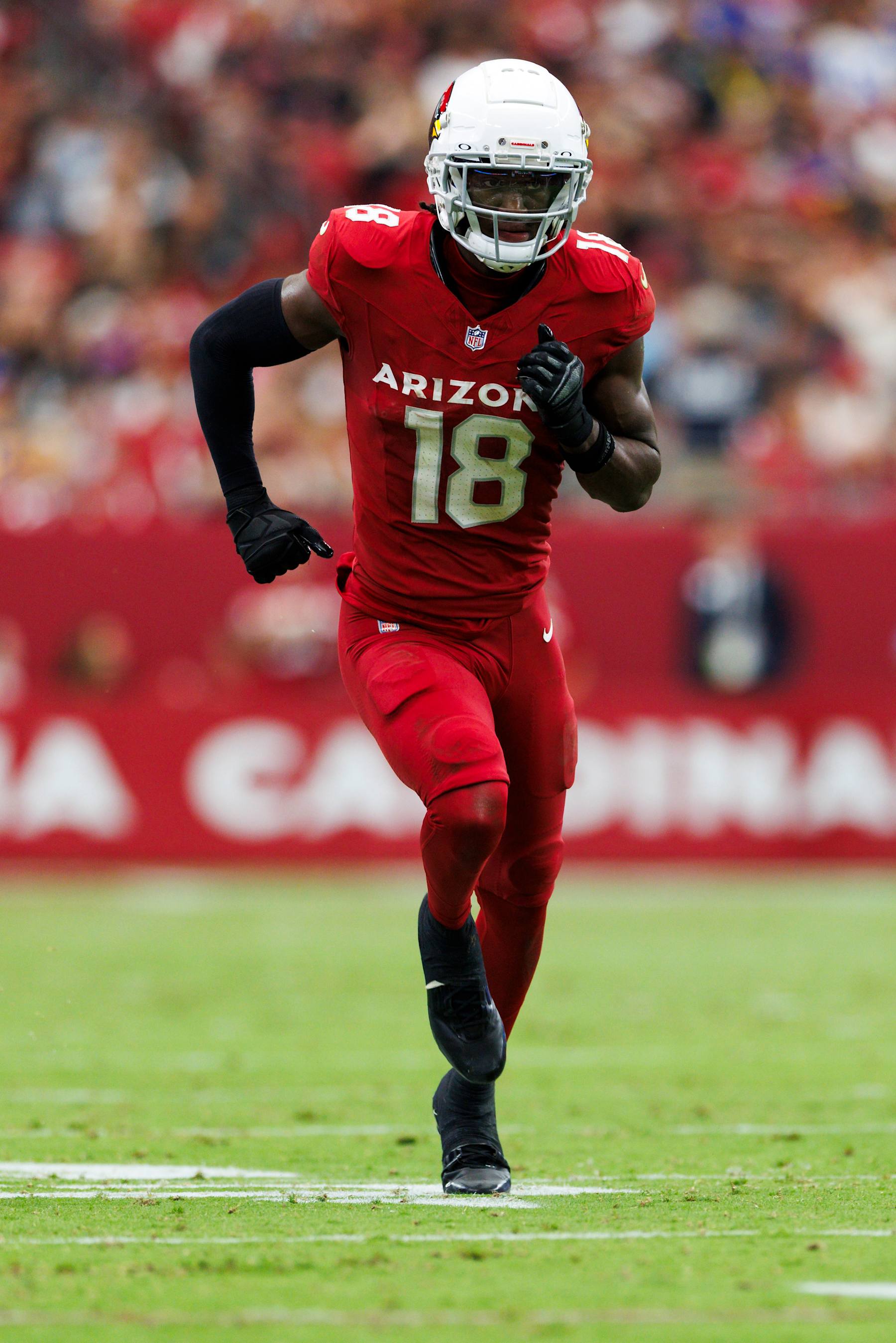 GLENDALE, ARIZONA - SEPTEMBER 15: Marvin Harrison Jr. #18 of the Arizona Cardinals runs a route during a game against the Los Angeles Rams at State Farm Stadium on September 15, 2024 in Glendale, Arizona. (Photo by Ric Tapia/Getty Images)