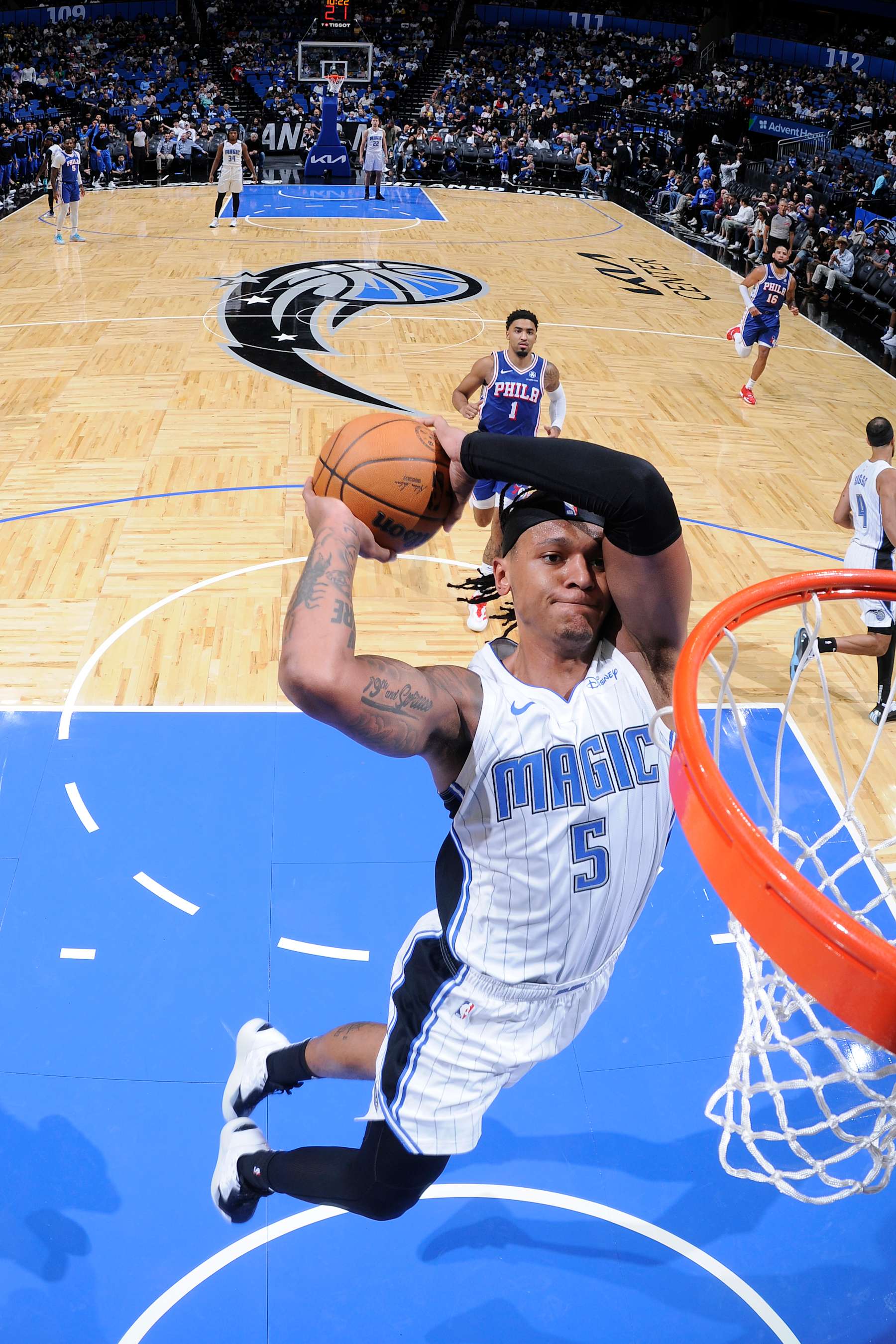 ORLANDO, FL - OCTOBER 18: Paolo Banchero #5 of the Orlando Magic dunks the ball during the game against the Philadelphia 76ers during a NBA preseason game on October 18, 2024 at Kia Center in Orlando, Florida. NOTE TO USER: User expressly acknowledges and agrees that, by downloading and or using this photograph, User is consenting to the terms and conditions of the Getty Images License Agreement. Mandatory Copyright Notice: Copyright 2024 NBAE (Photo by Fernando Medina/NBAE via Getty Images)