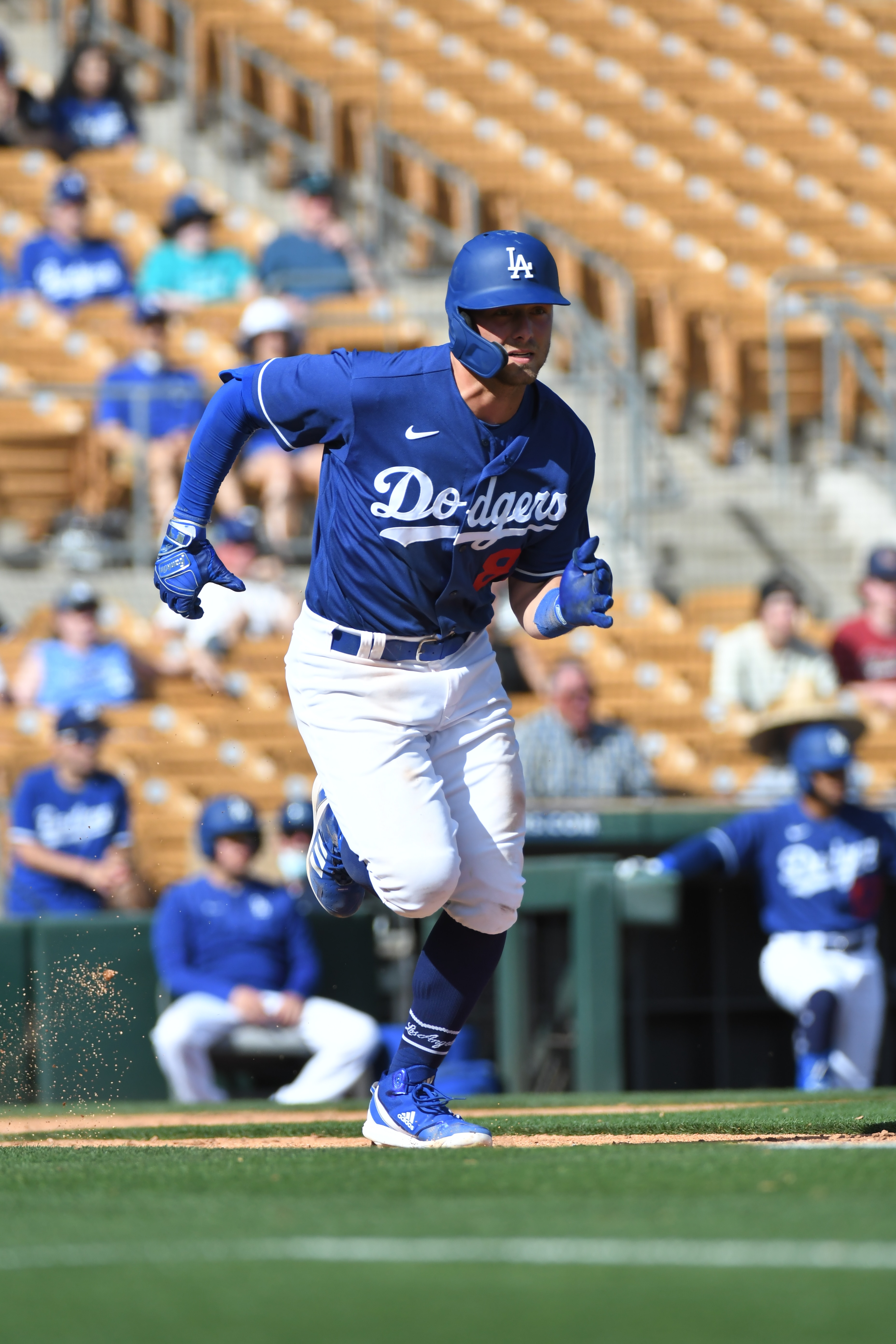 GLENDALE, AZ - MARCH 22, 2022: Michael Busch #84 of the Los Angeles Dodgers runs to first base during the eighth inning of an MLB spring training game against the Cincinnati Reds at Camelback Ranch on March 22, 2022 in Glendale, Arizona. (Photo by David Durochik/Diamond Images via Getty Images)