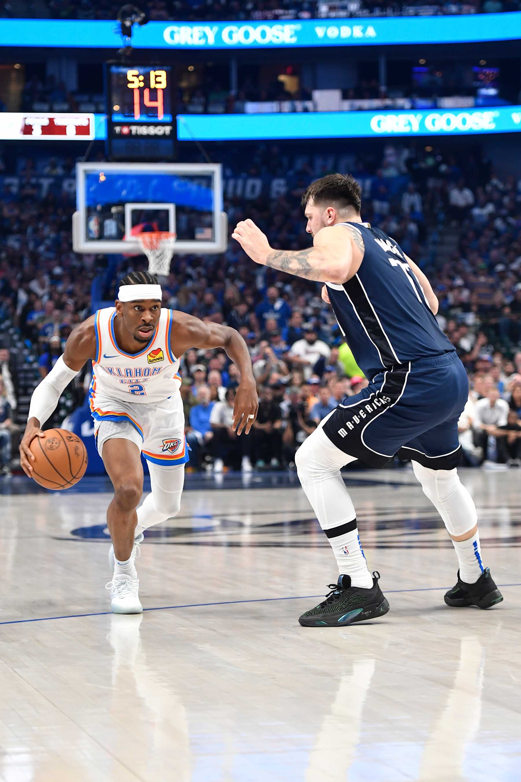 DALLAS, TX - MAY 13: Shai Gilgeous-Alexander #2 of the Oklahoma City Thunder drives to the basket against Luka Doncic #77 of the Dallas Mavericks during the game during Round 2 Game 4 of the 2024 NBA Playoffs on May 13, 2024 at the American Airlines Center in Dallas, Texas. NOTE TO USER: User expressly acknowledges and agrees that, by downloading and or using this photograph, User is consenting to the terms and conditions of the Getty Images License Agreement. Mandatory Copyright Notice: Copyright 2024 NBAE (Photo by Logan Riely/NBAE via Getty Images)