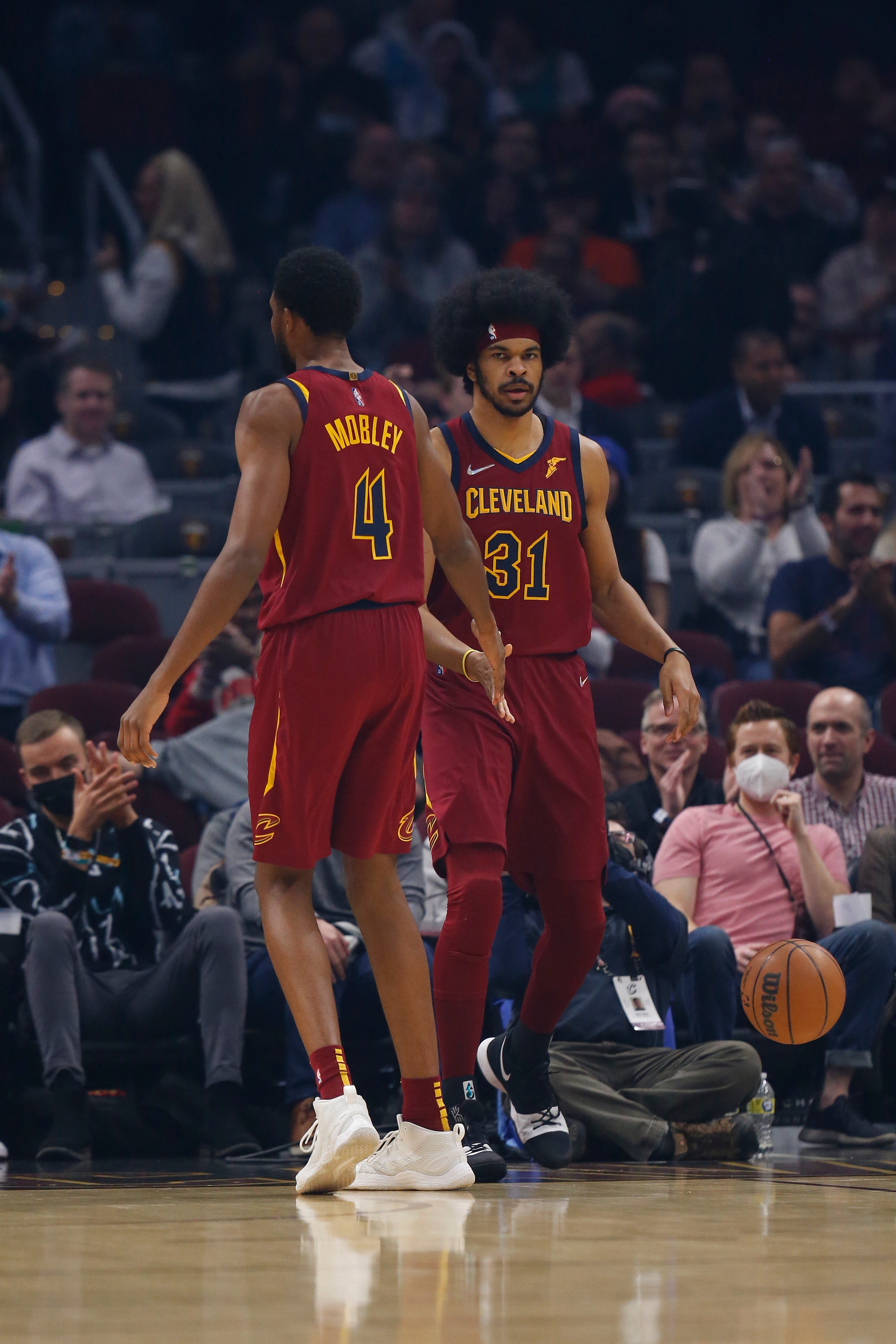 CLEVELAND, OH - MARCH 2: Evan Mobley #4 and Jarrett Allen #31 of the Cleveland Cavaliers high five during the game against the Charlotte Hornets on March 2, 2022 at Rocket Mortgage FieldHouse in Cleveland, Ohio. NOTE TO USER: User expressly acknowledges and agrees that, by downloading and/or using this Photograph, user is consenting to the terms and conditions of the Getty Images License Agreement. Mandatory Copyright Notice: Copyright 2022 NBAE (Photo by  Lauren Bacho/NBAE via Getty Images)