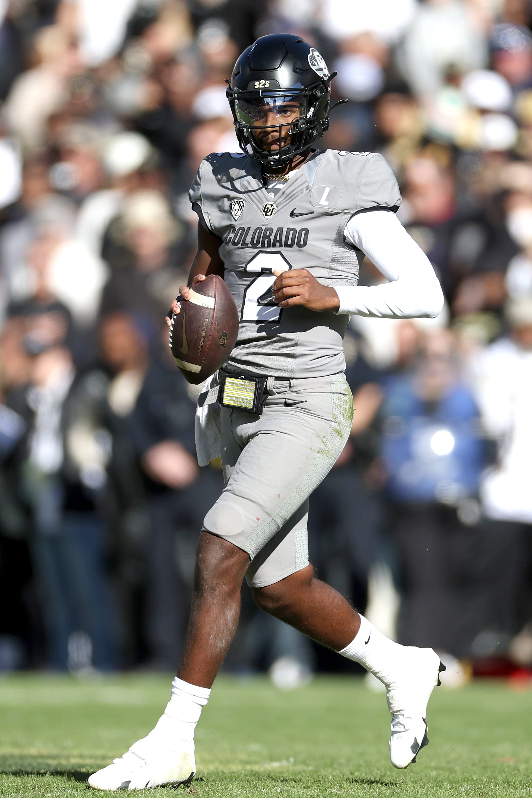 BOULDER, COLORADO - NOVEMBER 11: Quarterback Shedeur Sanders #2 of the Colorado Buffaloes runs out of the pocket against the Arizona Wildcats in the first quarter at Folsom Field on November 11, 2023 in Boulder, Colorado. (Photo by Matthew Stockman/Getty Images)