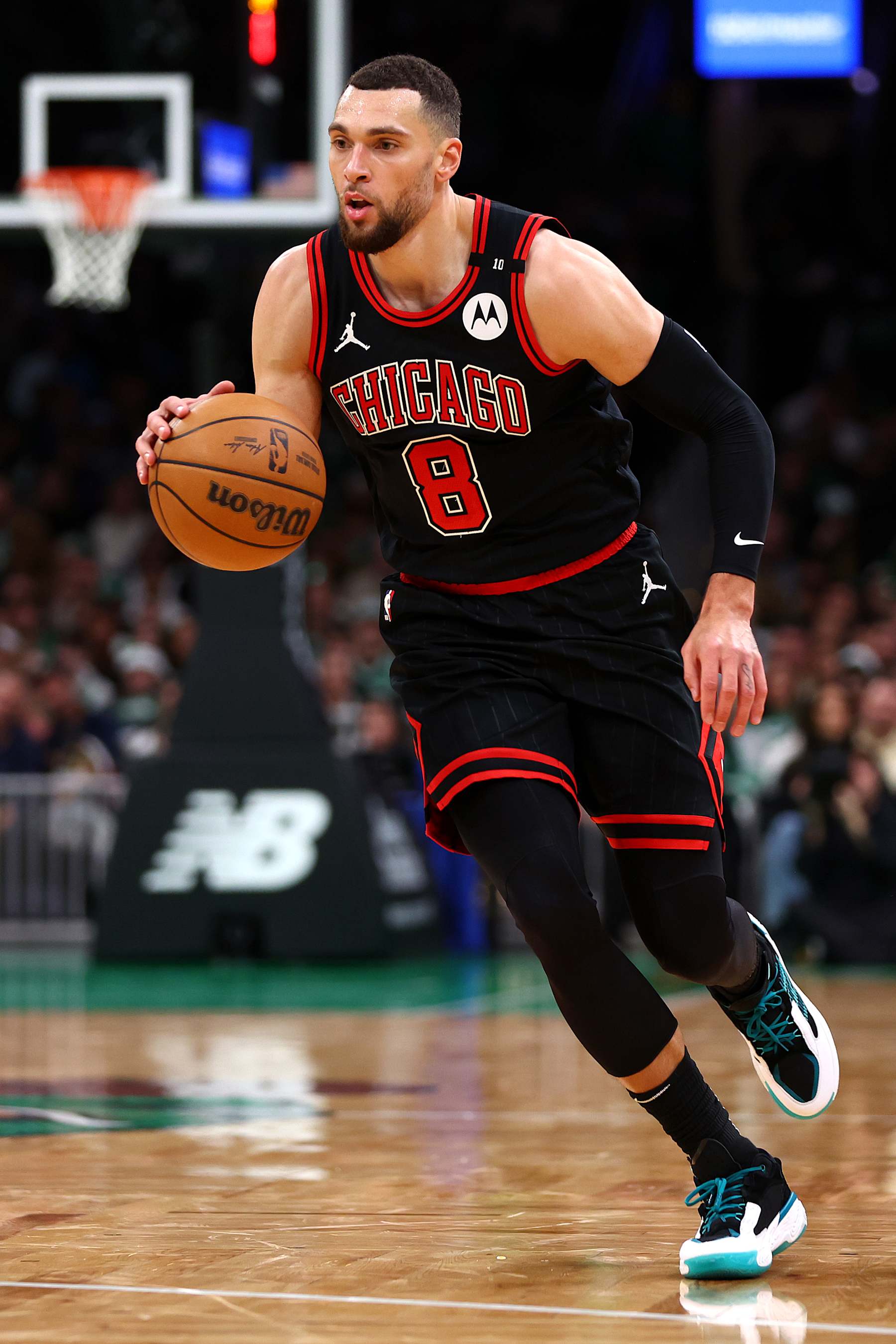 BOSTON, MASSACHUSETTS - DECEMBER 19: Zach LaVine #8 of the Chicago Bulls dribbles downcourt against the Boston Celtics during the second half at TD Garden on December 19, 2024 in Boston, Massachusetts. The Bulls defeat the Celtics 117-108.  (Photo by Maddie Meyer/Getty Images)