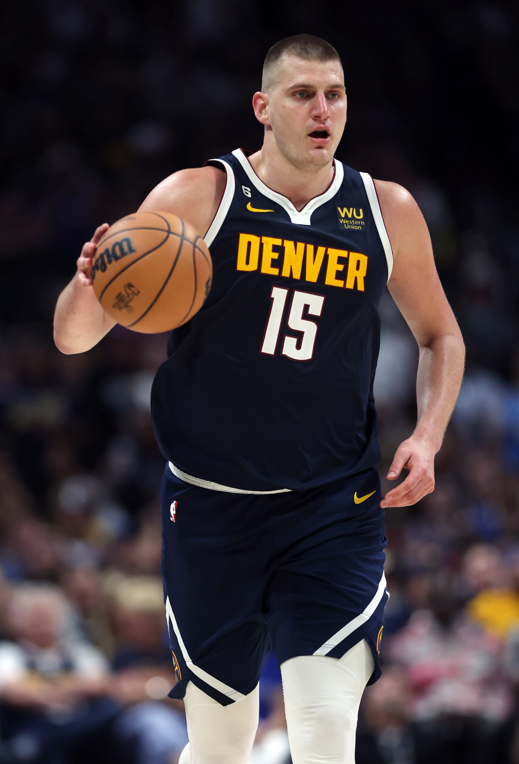 DENVER, COLORADO - JUNE 04: Nikola Jokic #15 of the Denver Nuggets dribbles the ball during the third quarter against the Miami Heat in Game Two of the 2023 NBA Finals at Ball Arena on June 04, 2023 in Denver, Colorado. NOTE TO USER: User expressly acknowledges and agrees that, by downloading and or using this photograph, User is consenting to the terms and conditions of the Getty Images License Agreement. (Photo by Matthew Stockman/Getty Images)