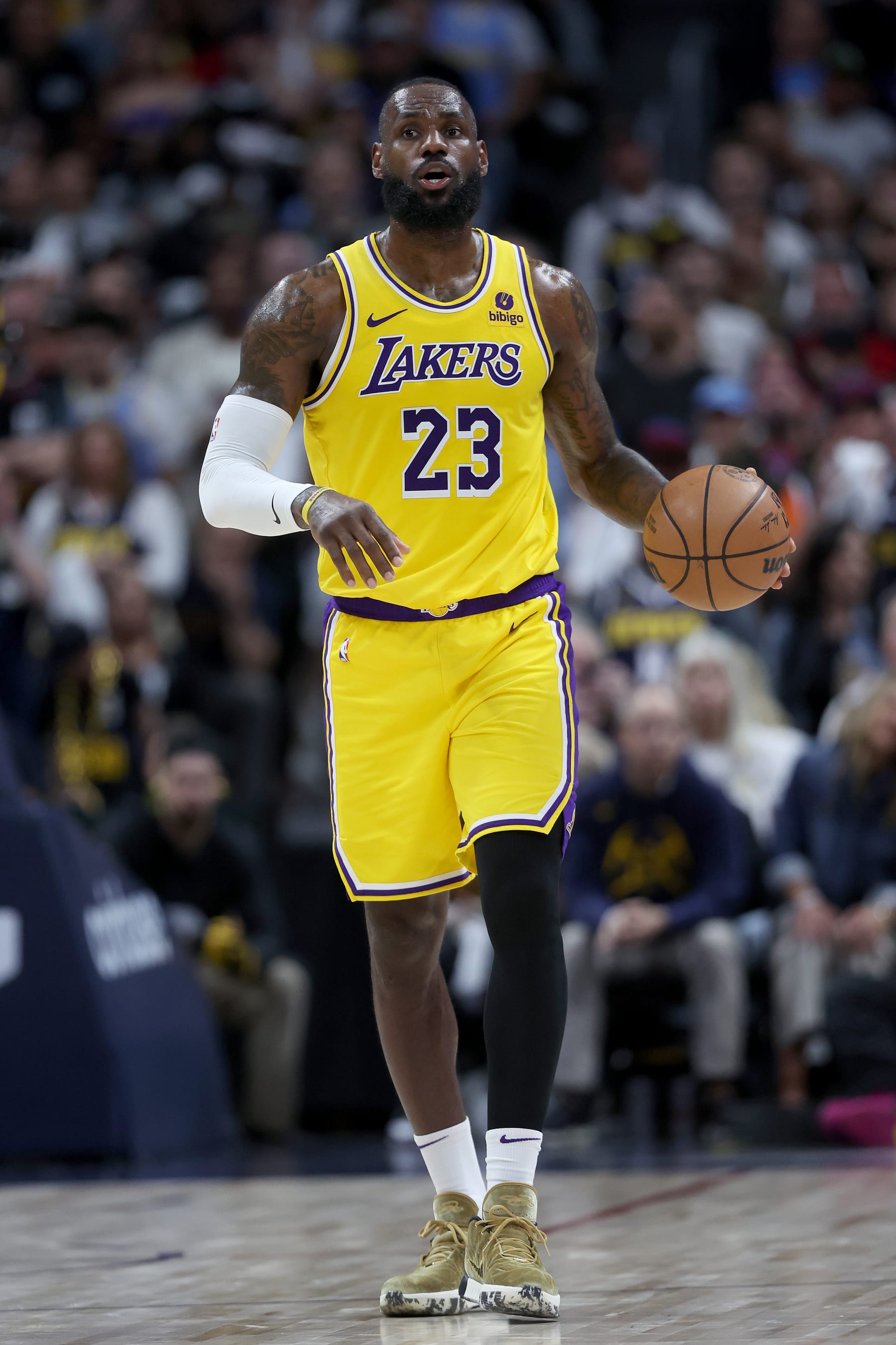 DENVER, COLORADO - APRIL 29: LeBron James #23 of the Los Angeles Lakers brings the ball down the court against the Denver Nuggets in the third quarter during game five of the Western Conference First Round Playoffs at Ball Arena on April 29, 2024 in Denver, Colorado. NOTE TO USER: User expressly acknowledges and agrees that, by downloading and or using this photograph, User is consenting to the terms and conditions of the Getty Images License Agreement.  (Photo by Matthew Stockman/Getty Images)