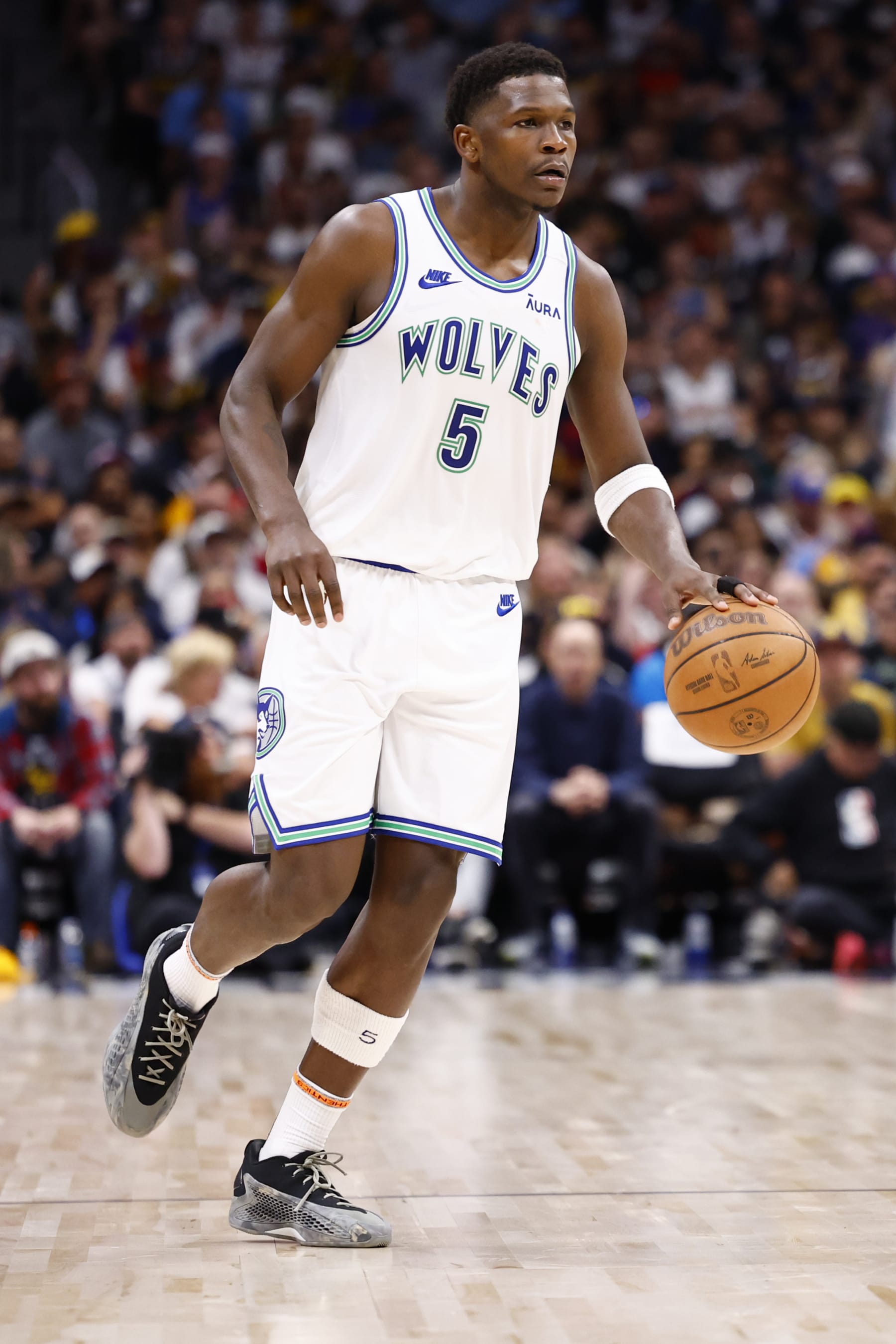 DENVER, COLORADO - MAY 19: Anthony Edwards #5 of the Minnesota Timberwolves handles the ball against the Denver Nuggets during Game Seven of the Western Conference Second Round Playoffs at Ball Arena on May 19, 2024 in Denver, Colorado. NOTE TO USER: User expressly acknowledges and agrees that, by downloading and or using this photograph, User is consenting to the terms and conditions of the Getty Images License Agreement. (Photo by C. Morgan Engel/Getty Images)