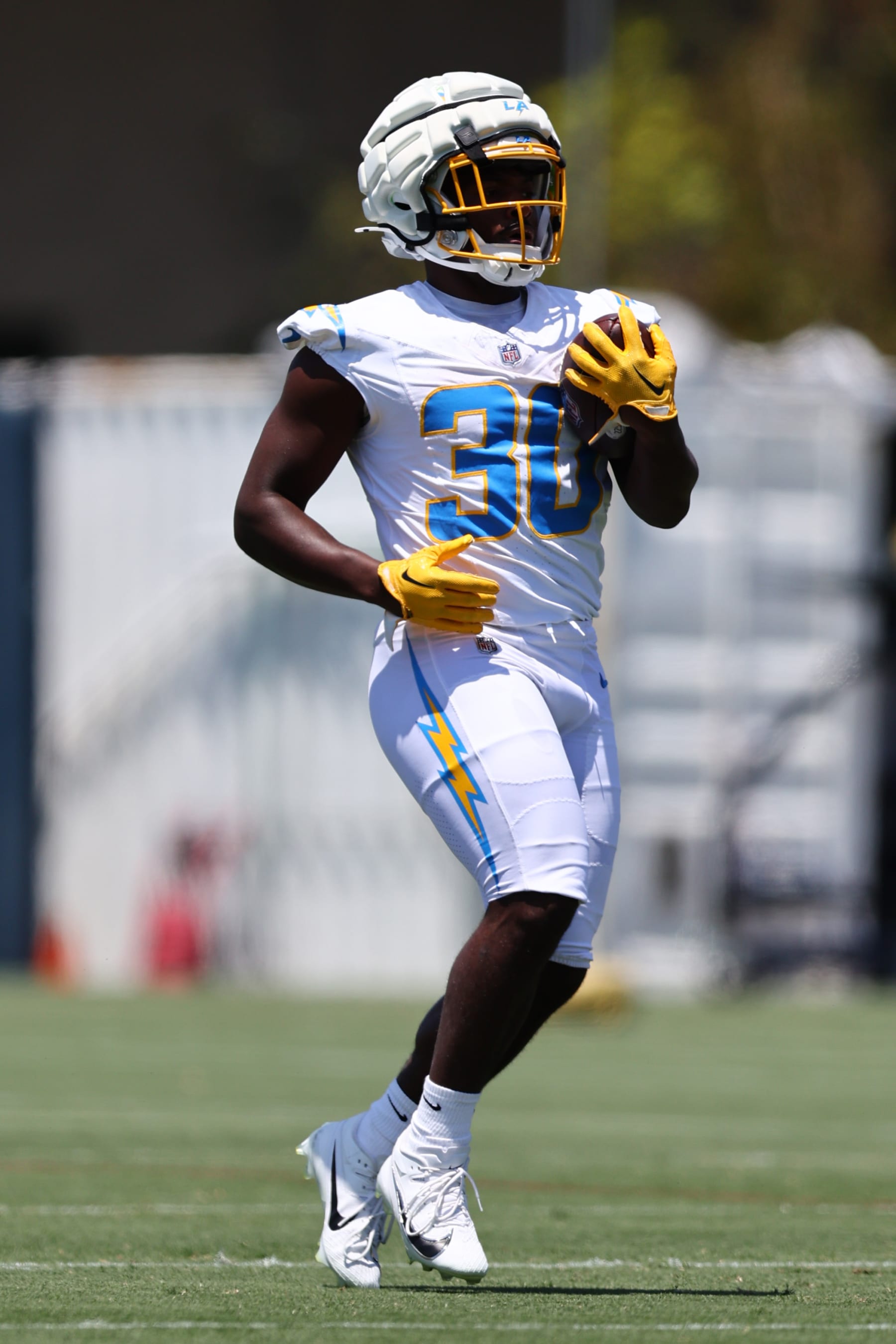 COSTA MESA, CALIFORNIA - MAY 29: Kimani Vidal #30 of the Los Angeles Chargers runs with the ball during a Los Angeles Chargers OTA Offseason Workout at Hoag Performance Center on May 29, 2024 in Costa Mesa, California. (Photo by Joe Scarnici/Getty Images)