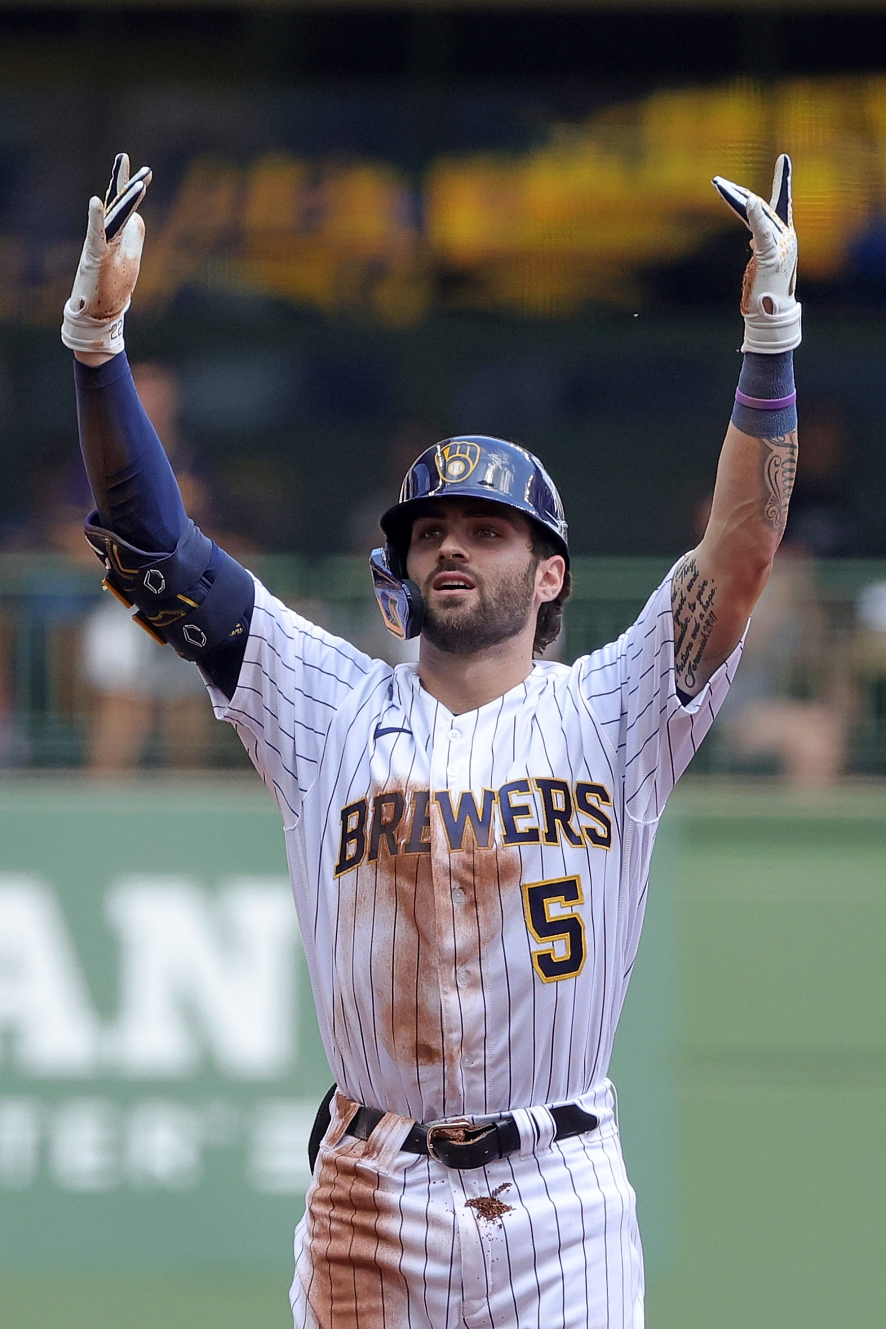 MILWAUKEE, WISCONSIN - AUGUST 28: Garrett Mitchel #5 of the Milwaukee Brewers gets a base hit against the Chicago Cubs during the fourth inning at American Family Field on August 28, 2022 in Milwaukee, Wisconsin. (Photo by Stacy Revere/Getty Images)
