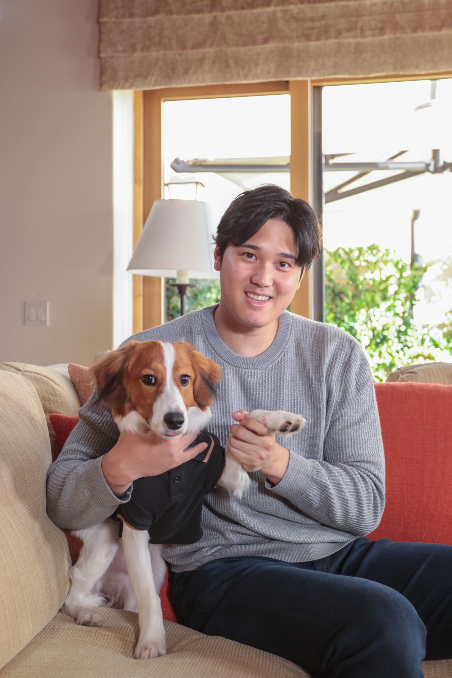 NEWPORT BEACH, CA - NOVEMBER 16 - Shohei Ohtani poses for a photo with his dog prior to the announcement Ohtani winning the 2023 American League Most Valuable Player Award on November 16, 2023 in Newport Beach, California. (Photo by Emma Sharon/MLB Photos via Getty Images