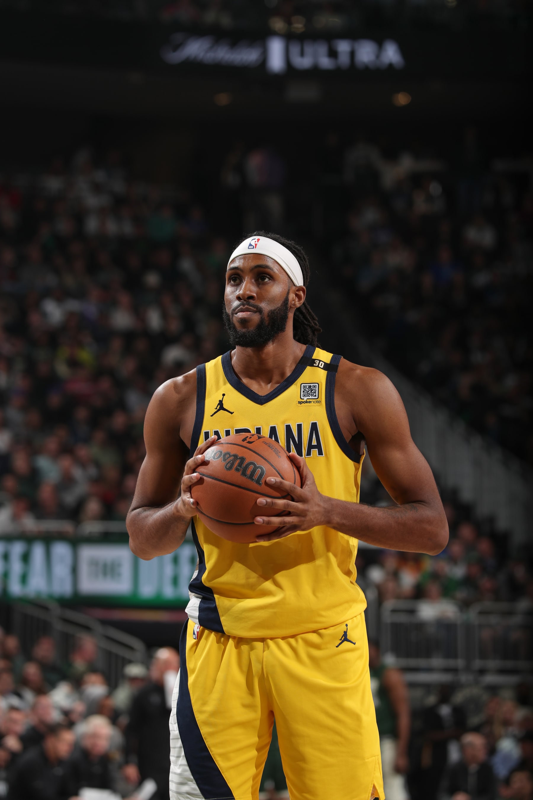 MILWAUKEE, WI - APRIL 30:  Isaiah Jackson #22 of the Indiana Pacers shoots a free throw during the game against the Milwaukee Bucks  during Round 1 Game 5 of the 2024 NBA Playoffs on April 30, 2024 at the Fiserv Forum Center in Milwaukee, Wisconsin. NOTE TO USER: User expressly acknowledges and agrees that, by downloading and or using this Photograph, user is consenting to the terms and conditions of the Getty Images License Agreement. Mandatory Copyright Notice: Copyright 2024 NBAE (Photo by Gary Dineen/NBAE via Getty Images).
