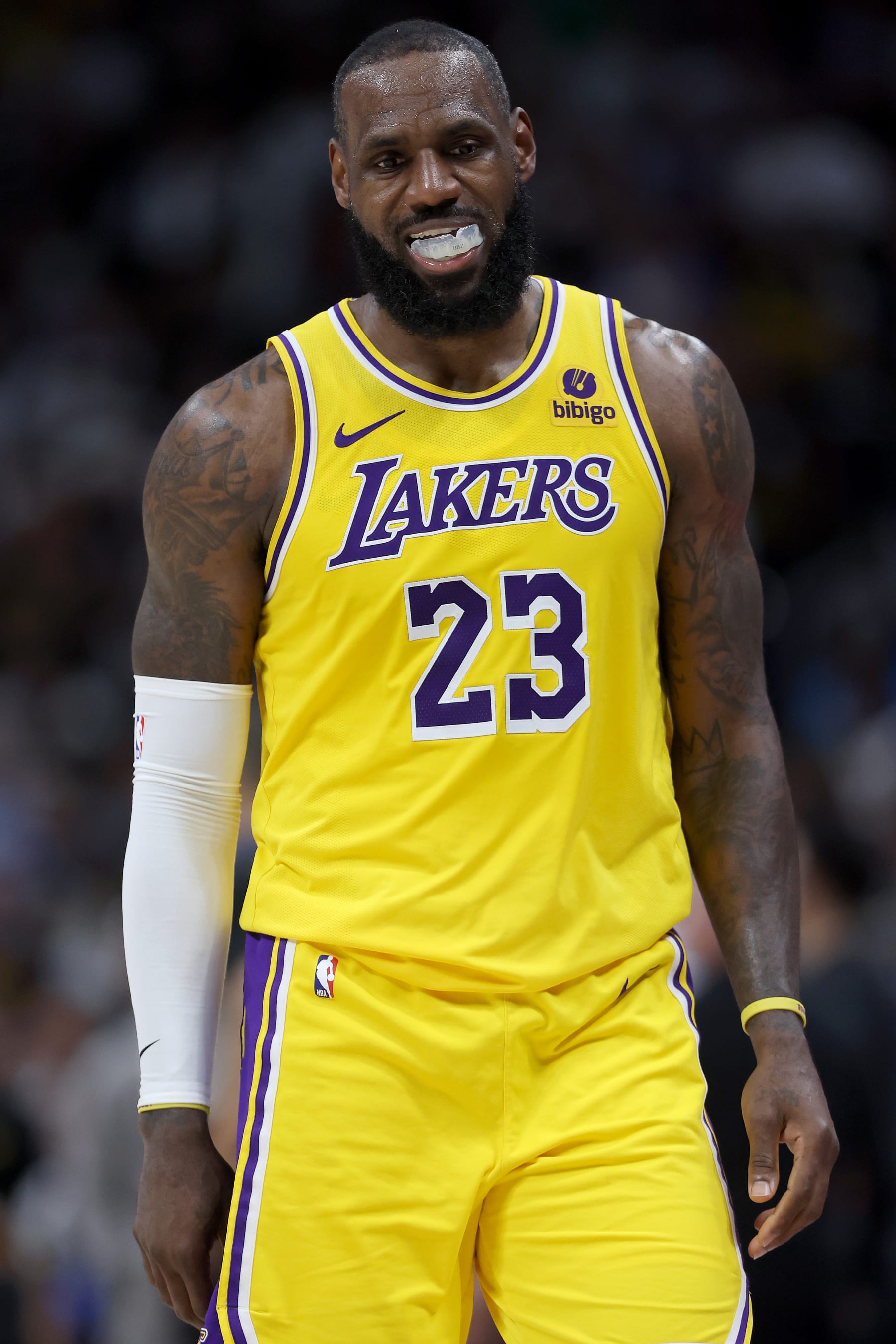 DENVER, COLORADO - APRIL 22:  LeBron James #23 of the Los Angeles Lakers walks back to his bench while playing the Denver Nuggets in the fourth quarter during game two of the Western Conference First Round Playoffs at Ball Arena on April 22, 2024 in Denver, Colorado. NOTE TO USER: User expressly acknowledges and agrees that, by downloading and or using this photograph, User is consenting to the terms and conditions of the Getty Images License Agreement. (Photo by Matthew Stockman/Getty Images)