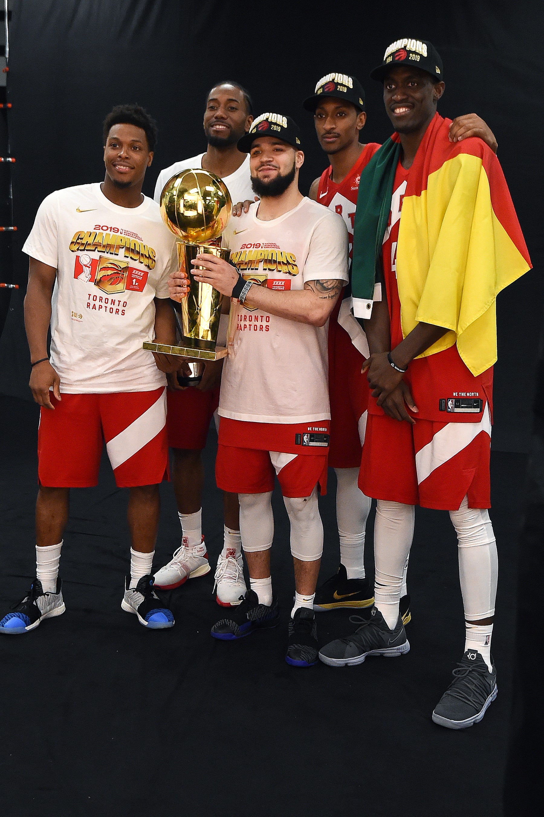 OAKLAND, CA - JUNE 13: Kyle Lowry #7, Kawhi Leonard #2, Fred VanVleet #23, Malcolm Miller #13, and Pascal Siakam #43 of the Toronto Raptors pose for a photo with the Larry O'Brien Championship Trophy after Game Six of the NBA Finals against the Golden State Warriors on June 13, 2019 at ORACLE Arena in Oakland, California. NOTE TO USER: User expressly acknowledges and agrees that, by downloading and/or using this photograph, user is consenting to the terms and conditions of Getty Images License Agreement. Mandatory Copyright Notice: Copyright 2019 NBAE (Photo by Andrew D. Bernstein/NBAE via Getty Images)