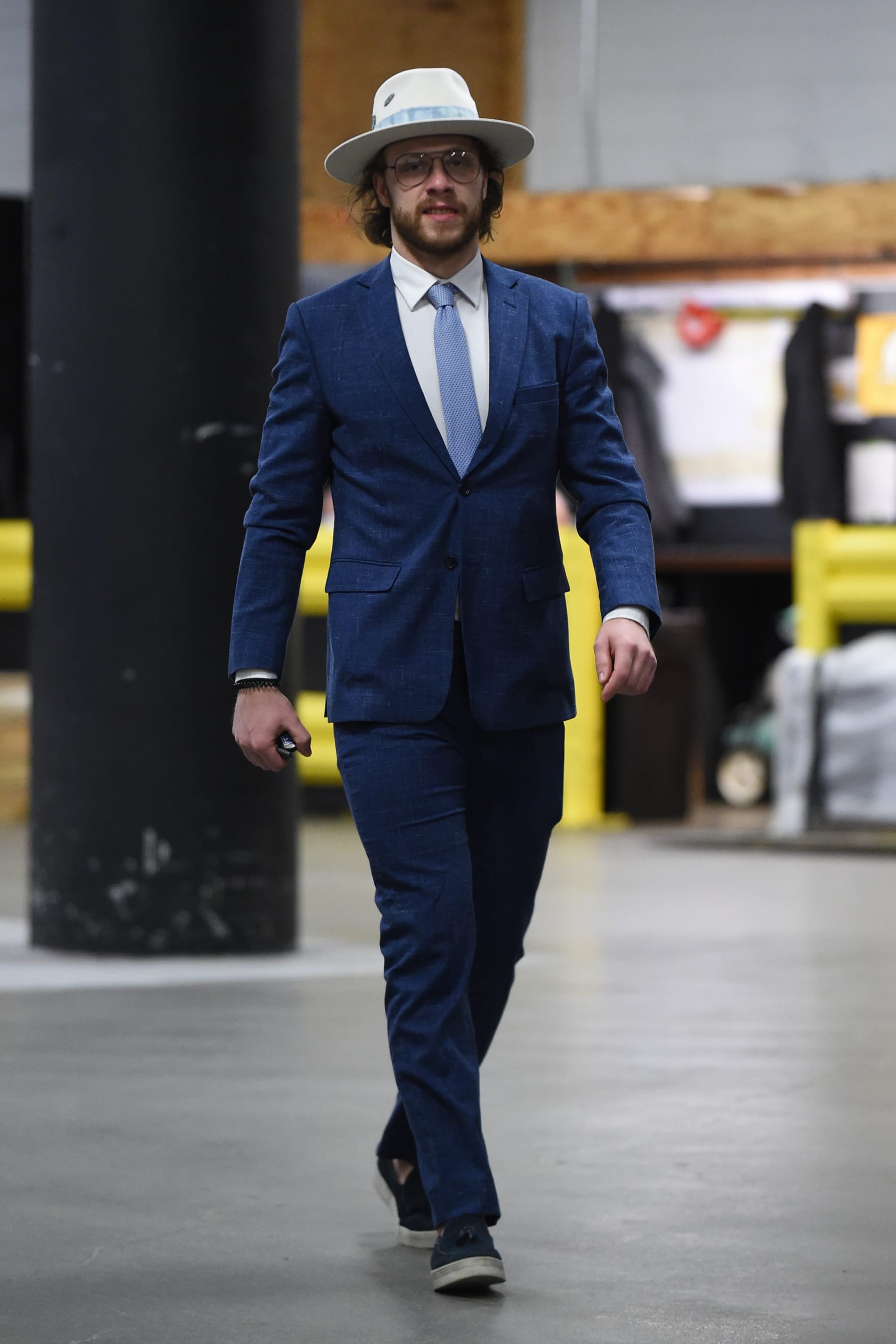 BOSTON, MA - JANUARY 13: David Pastrnak #88 of the Boston Bruins arrives before the game against the Philadelphia Flyers at the TD Garden on January 13, 2022 in Boston, Massachusetts. (Photo by Steve Babineau/NHLI via Getty Images)