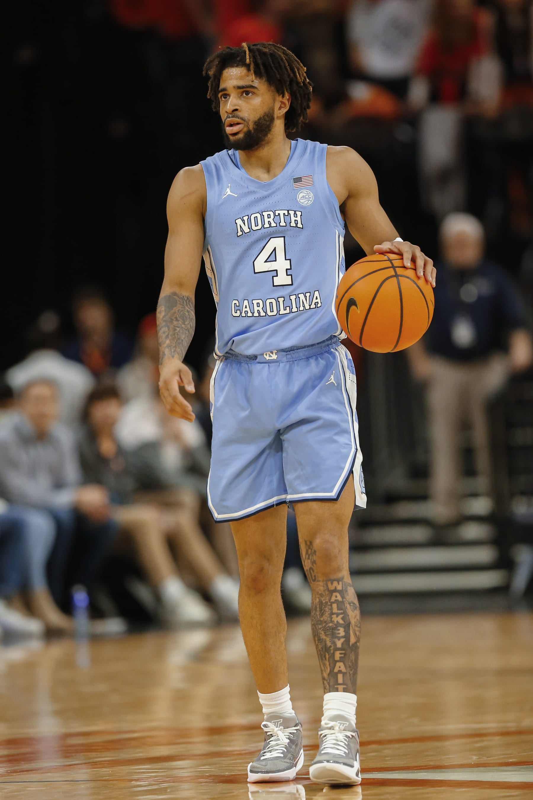 CHARLOTTESVILLE, VA - FEBRUARY 24: North Carolina Tar Heels guard RJ Davis (4) dribbles the ball up the court during a men's college basketball game between the North Carolina Tar Heels and the Virginia Cavaliers on February 24, 2024, at John Paul Jones Arena in Charlottesville, VA. (Photo by Lee Coleman/Icon Sportswire via Getty Images)