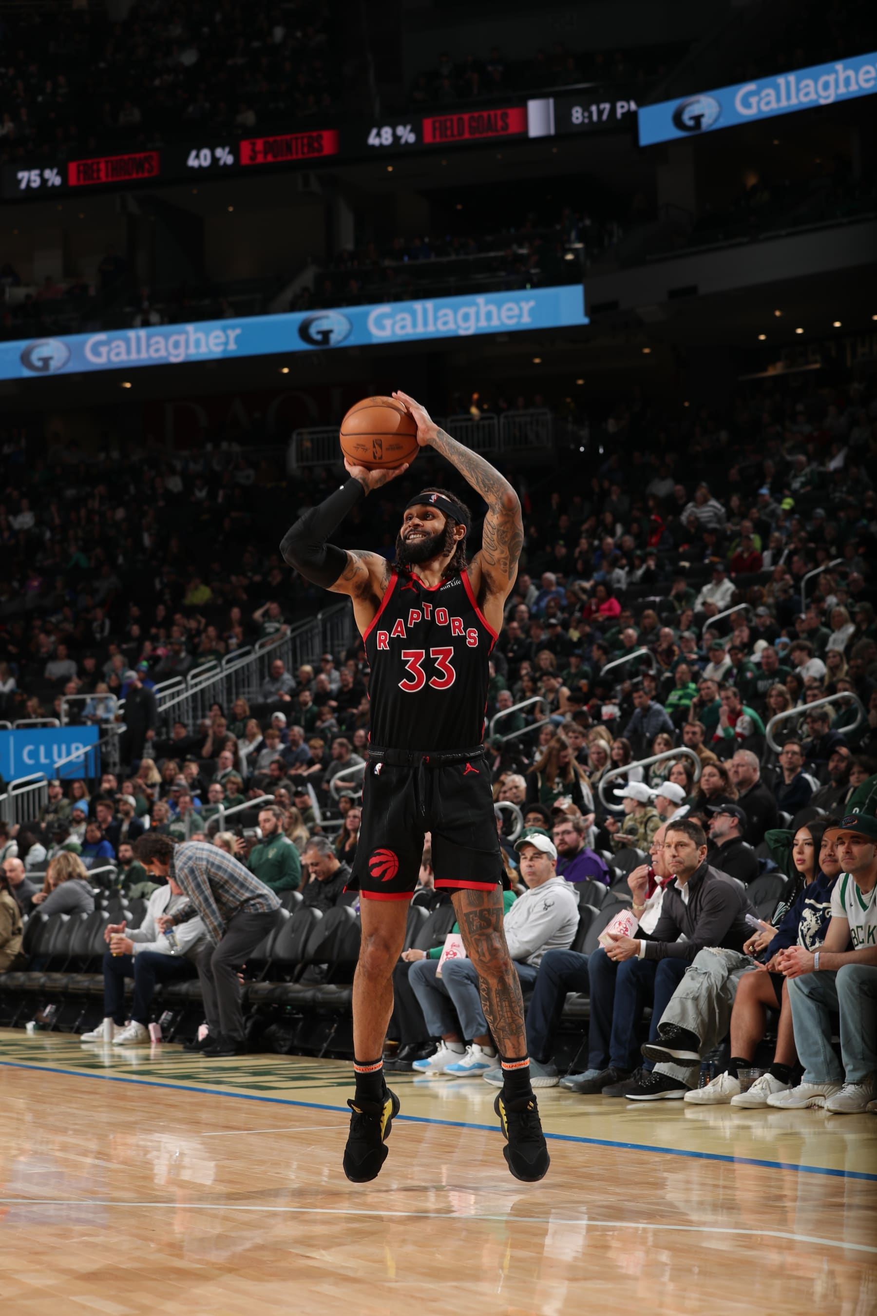 MILWAUKEE, WI - APRIL 5: Gary Trent Jr. #33 of the Toronto Raptors shoots the ball during the game against the Milwaukee Bucks on April 5, 2024 at the Fiserv Forum Center in Milwaukee, Wisconsin. NOTE TO USER: User expressly acknowledges and agrees that, by downloading and or using this Photograph, user is consenting to the terms and conditions of the Getty Images License Agreement. Mandatory Copyright Notice: Copyright 2024 NBAE (Photo by Gary Dineen/NBAE via Getty Images).