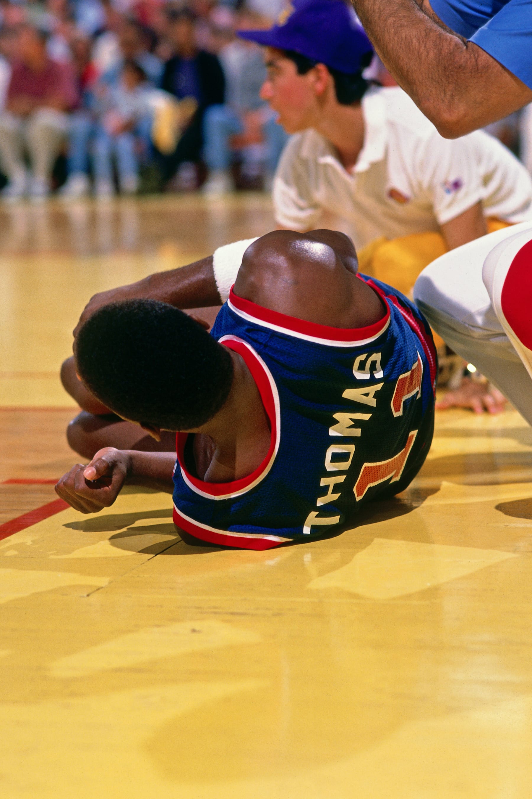 INGLEWOOD, CA - JUNE 19: Isiah Thomas #11 of the Detroit Pistons injures his ankel against the Los Angeles Lakers during Game Six of the 1988 WNBA Finals on June 19, 1988 at the Great Western Forum in Inglewood, California. NOTE TO USER: User expressly acknowledges and agrees that, by downloading and or using this photograph, User is consenting to the terms and conditions of the Getty Images License Agreement. Mandatory Copyright Notice: Copyright 1988 NBAE (Photo by Andrew D. Bernstein/NBAE via Getty Images)