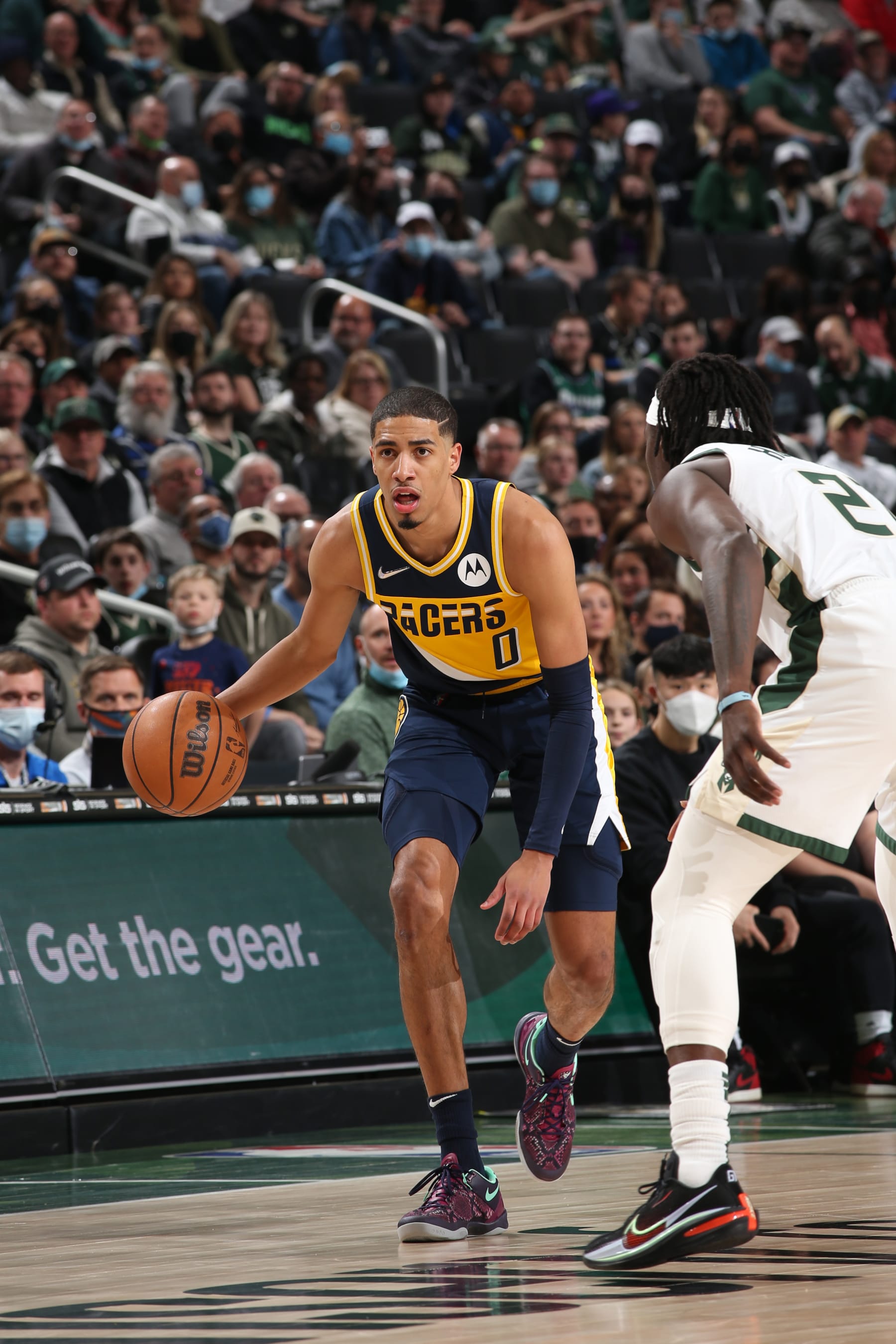 MILWAUKEE, WI - FEBRUARY 15: Tyrese Haliburton #0 of the Indiana Pacers dribbles the ball during the game against the Milwaukee Bucks on February 15, 2022 at the Fiserv Forum Center in Milwaukee, Wisconsin. NOTE TO USER: User expressly acknowledges and agrees that, by downloading and or using this Photograph, user is consenting to the terms and conditions of the Getty Images License Agreement. Mandatory Copyright Notice: Copyright 2022 NBAE (Photo by Gary Dineen/NBAE via Getty Images).