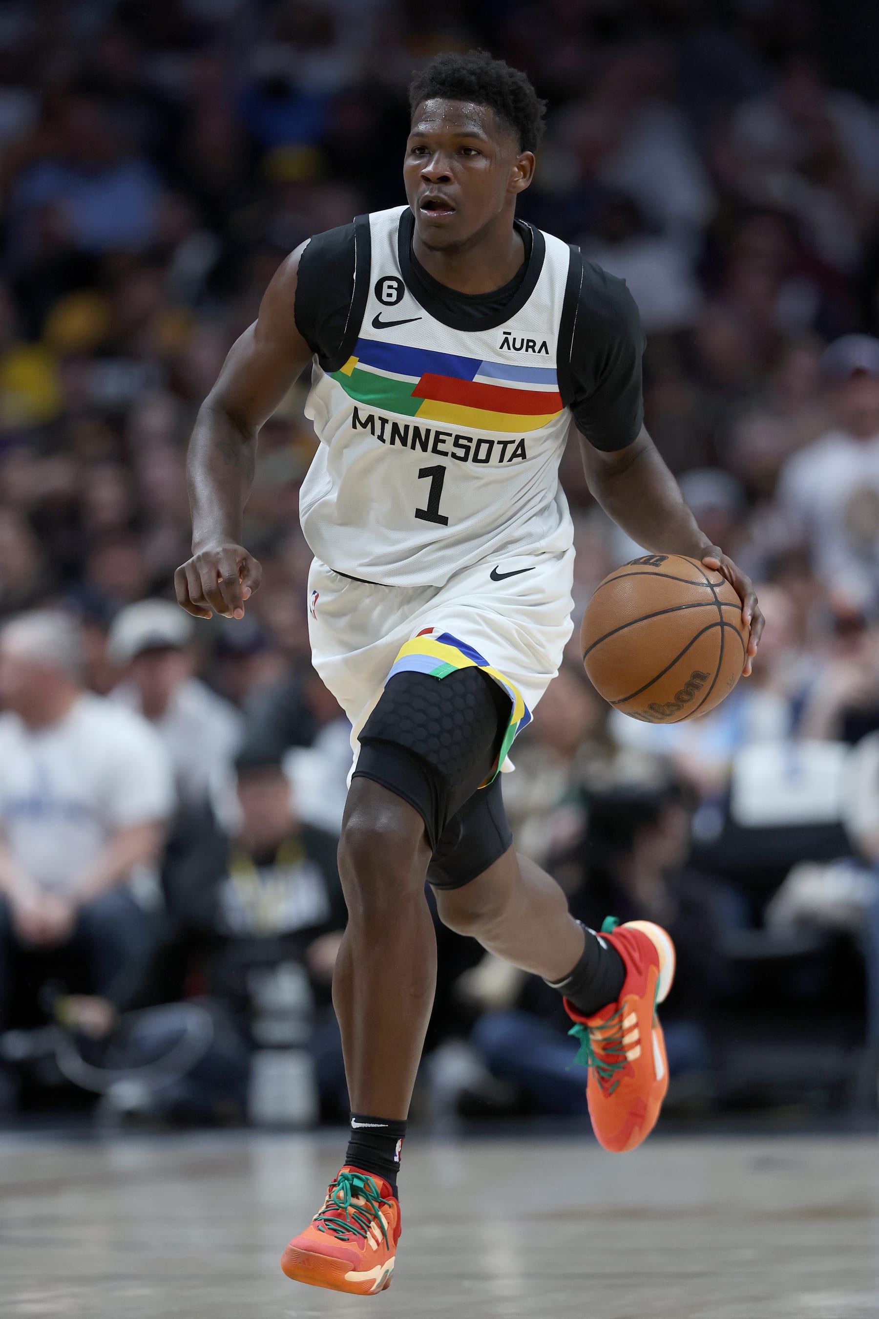 DENVER, COLORADO - APRIL 19: Anthony Edwards #1 of the Minnesota Timberwolves brings the ball down the court against the Denver Nuggets in the first quarter during Round 1 Game 2 of the NBA Playoffs at Ball Arena on April 19, 2023 in Denver, Colorado. NOTE TO USER: User expressly acknowledges and agrees that, by downloading and/or using this photograph, User is consenting to the terms and conditions of the Getty Images License Agreement.  (Photo by Matthew Stockman/Getty Images)