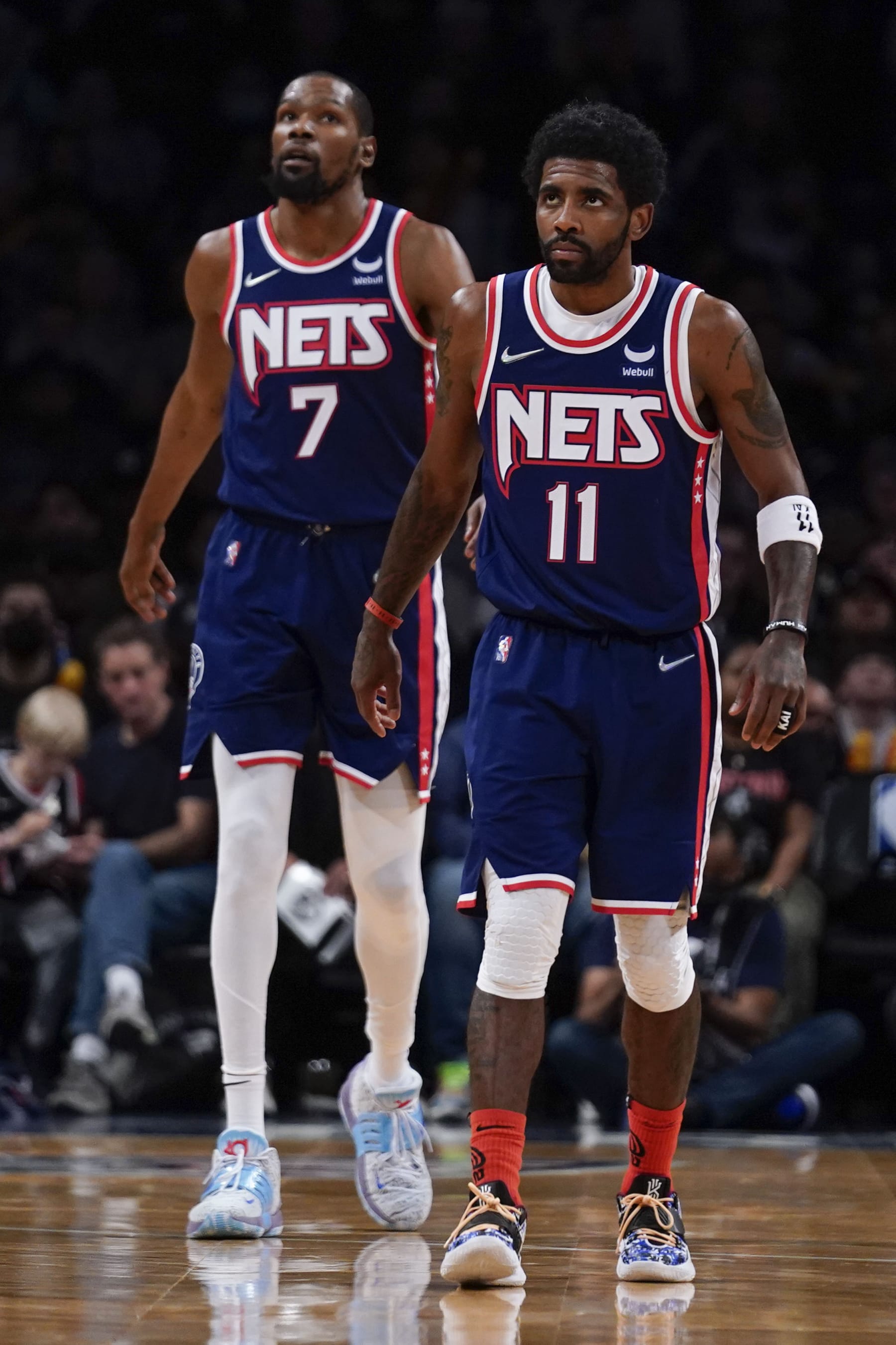 Brooklyn Nets' Kyrie Irving, right, and Kevin Durant during the second half of an NBA basketball game against the Indiana Pacers at the Barclays Center, Sunday, Apr. 10, 2022, in New York. The Nets defeated the Pacers 134-126. (AP Photo/Seth Wenig)