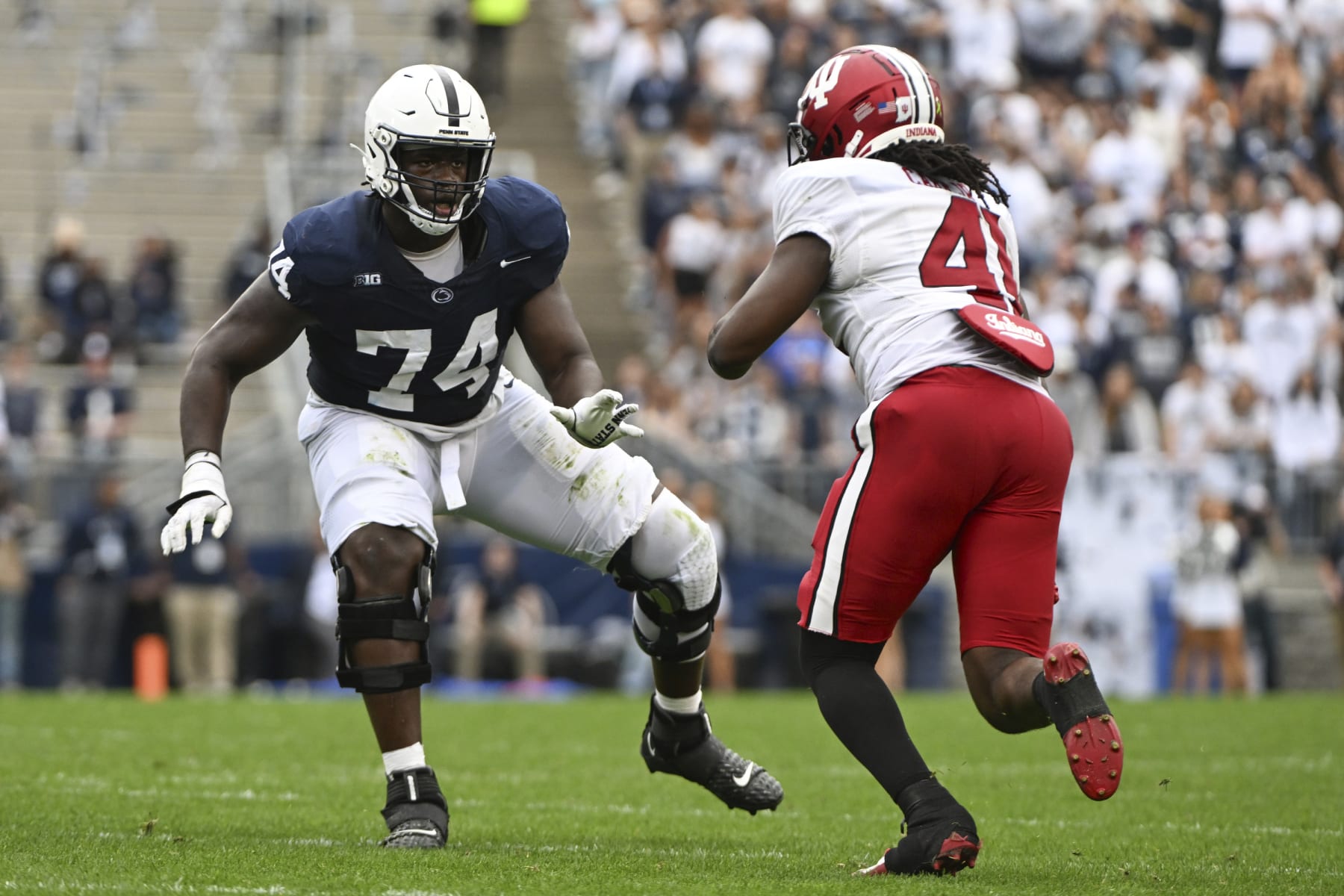 Penn State offensive lineman Olumuyiwa Fashanu (74) looks to block Indiana linebacker Lanell Carr Jr. (41) during the first half of an NCAA college football game, Saturday, Oct. 28, 2023, in State College, Pa. (AP Photo/Barry Reeger)