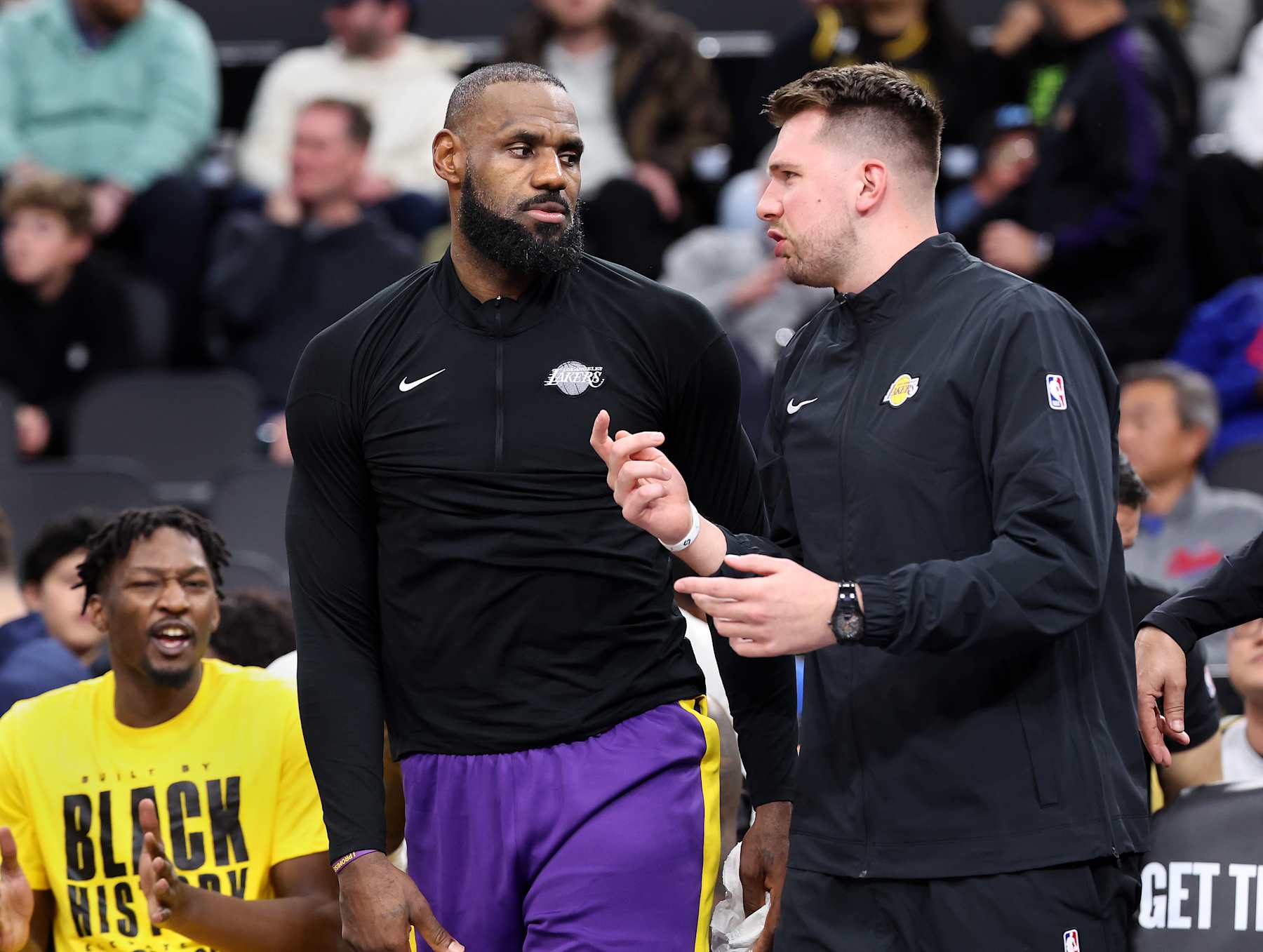 Inglewood, California February 4, 2025-Lakers LeBron James, left, and Luka Doncic talk during a timeout at the Intuit Dome Tuesday. (Wally Skalij/Los Angeles Times via Getty Images)