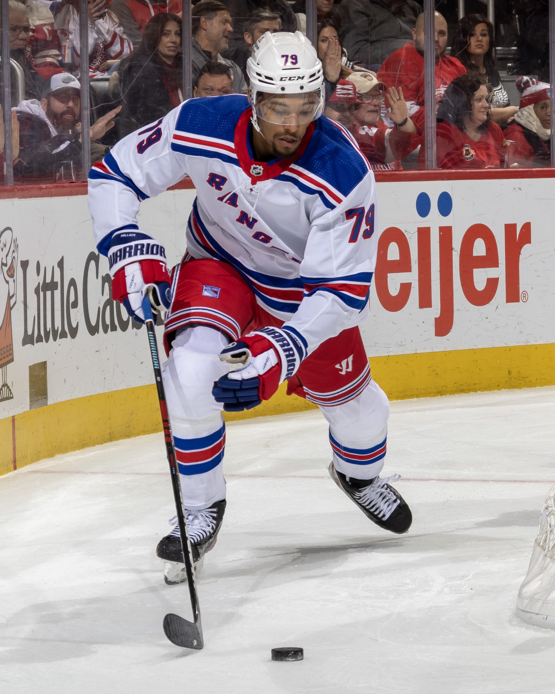 DETROIT, MI - FEBRUARY 23: K'Andre Miller #79 of the New York Rangers controls the puck behind the net against the Detroit Red Wings during the third period of an NHL game at Little Caesars Arena on February 23, 2023 in Detroit, Michigan. Detroit defeated New York 4-1.(Photo by Dave Reginek/NHLI via Getty Images)