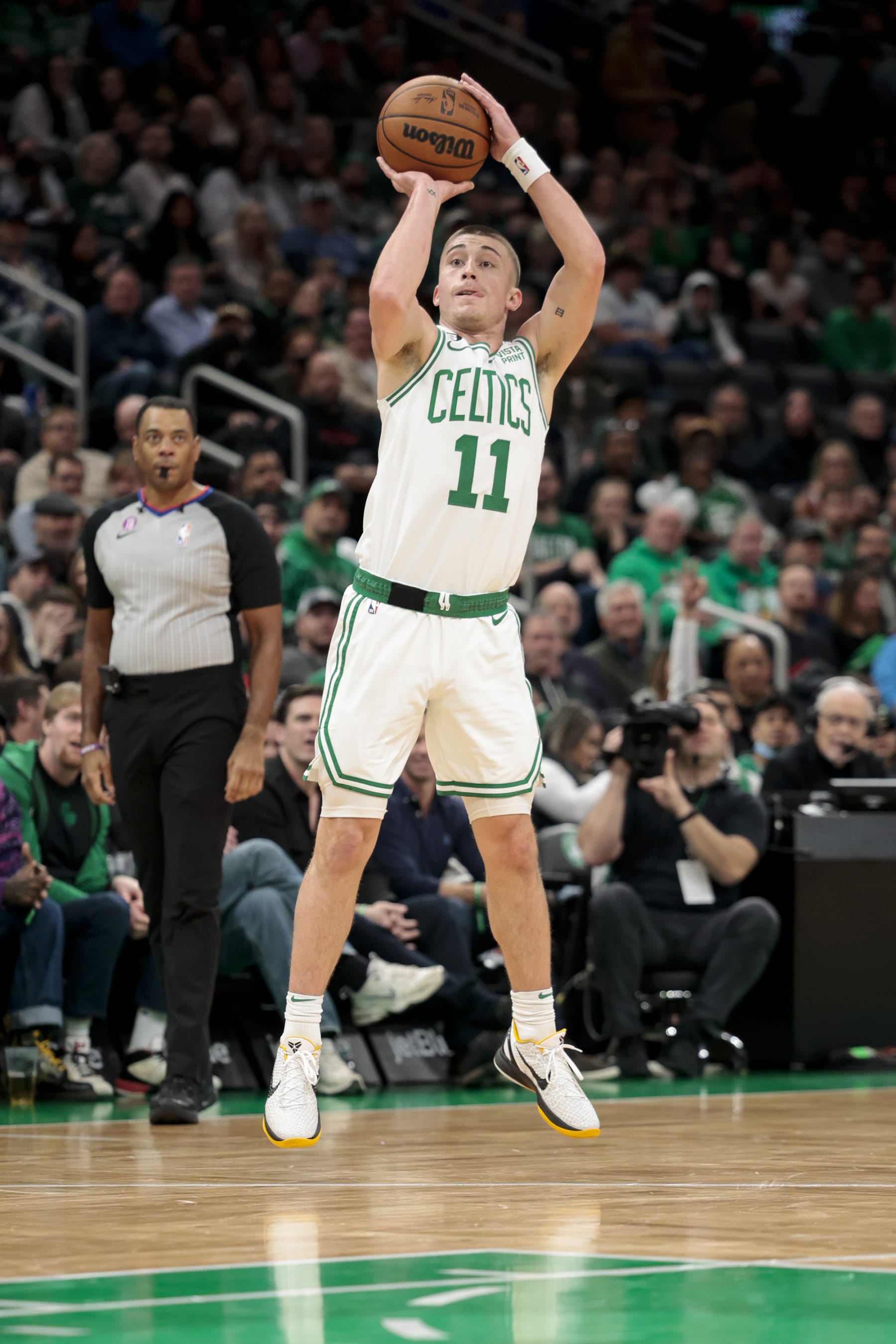 BOSTON, MA - NOVEMBER 28  Payton Pritchard #11 of the Boston Celtics shoots a three-point basket during a game against the Charlotte Hornets at TD Garden on November 28, 2022 in Boston, Massachusetts. NOTE TO USER: User expressly acknowledges and agrees that, by downloading and or using this photograph, User is consenting to the terms and conditions of the Getty Images License Agreement. (Photo by Adam Glanzman/Getty Images)
