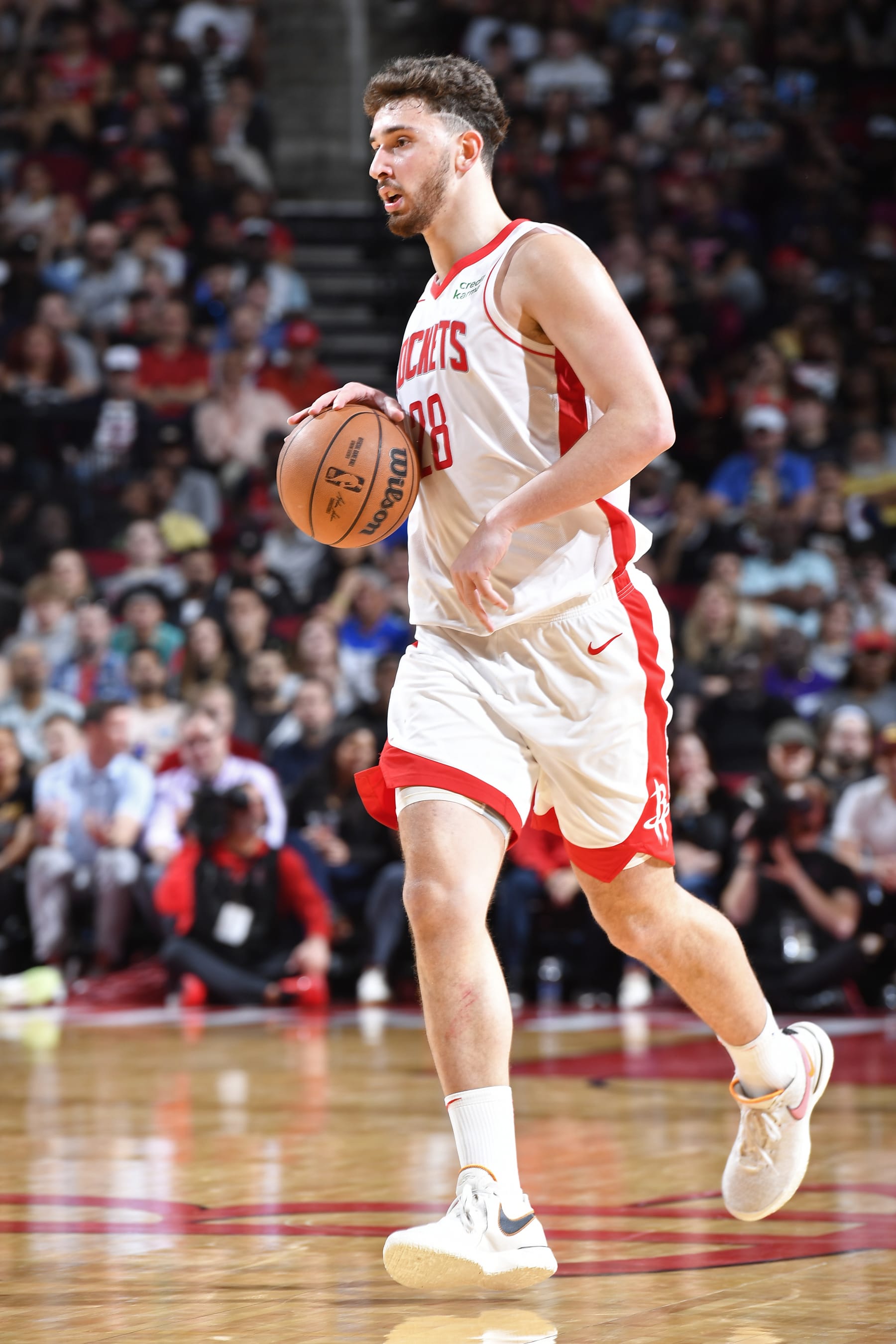 HOUSTON, TX - MARCH 5:  Alperen Sengun #28 of the Houston Rockets dribbles the ball during the game against the San Antonio Spurs on March 5, 2024 at the Toyota Center in Houston, Texas. NOTE TO USER: User expressly acknowledges and agrees that, by downloading and or using this photograph, User is consenting to the terms and conditions of the Getty Images License Agreement. Mandatory Copyright Notice: Copyright 2024 NBAE (Photo by Logan Riely/NBAE via Getty Images)