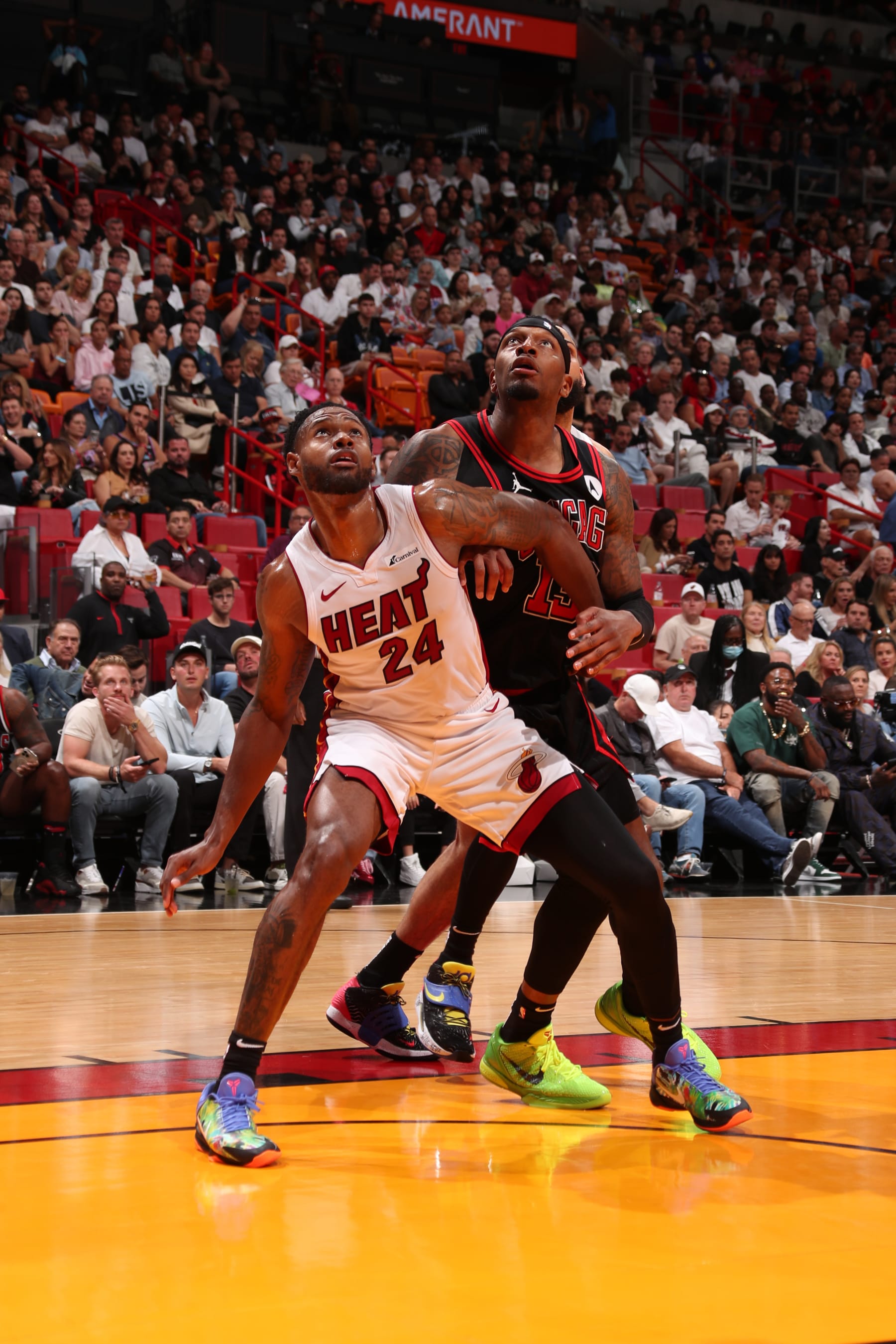 MIAMI, FL - APRIL 19: Haywood Highsmith #24 of the Miami Heat boxes out against Torrey Craig #13 of Chicago Bulls during the game during the 2024 Play-In Tournament on April 19, 2024 at Kaseya Center in Miami, Florida. NOTE TO USER: User expressly acknowledges and agrees that, by downloading and or using this Photograph, user is consenting to the terms and conditions of the Getty Images License Agreement. Mandatory Copyright Notice: Copyright 2024 NBAE (Photo by Issac Baldizon/NBAE via Getty Images)