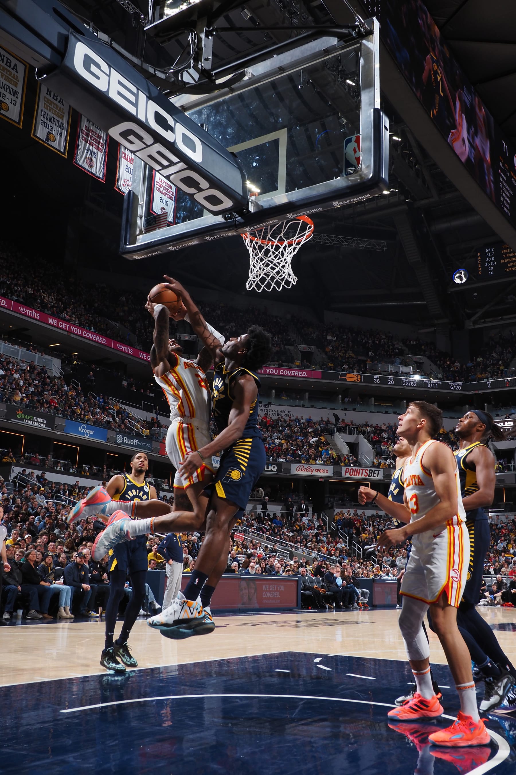 INDIANAPOLIS, IN - DECEMBER 27: John Collins #20 of the Atlanta Hawks drives to the basket during the game against the Indiana Pacers on December 27, 2022 at Gainbridge Fieldhouse in Indianapolis, Indiana. NOTE TO USER: User expressly acknowledges and agrees that, by downloading and or using this Photograph, user is consenting to the terms and conditions of the Getty Images License Agreement. Mandatory Copyright Notice: Copyright 2022 NBAE (Photo by Ron Hoskins/NBAE via Getty Images)