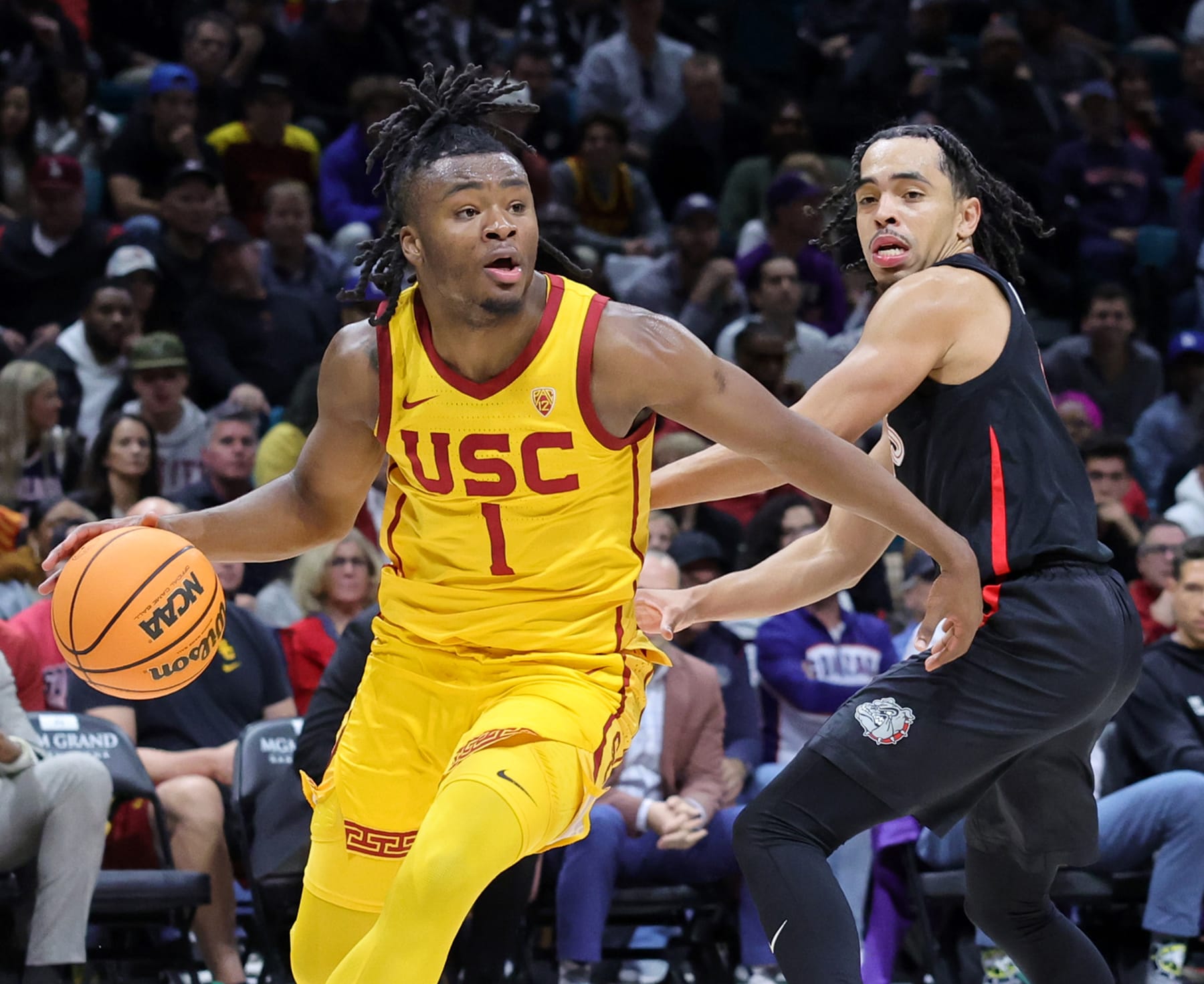 LAS VEGAS, NEVADA - DECEMBER 02: Isaiah Collier #1 of the USC Trojans drives against Ryan Nembhard #0 of the Gonzaga Bulldogs in the second half of their game during the Legends of Basketball Las Vegas Invitational at MGM Grand Garden Arena on December 02, 2023 in Las Vegas, Nevada. The Bulldogs defeated the Trojans 89-76. (Photo by Ethan Miller/Getty Images)