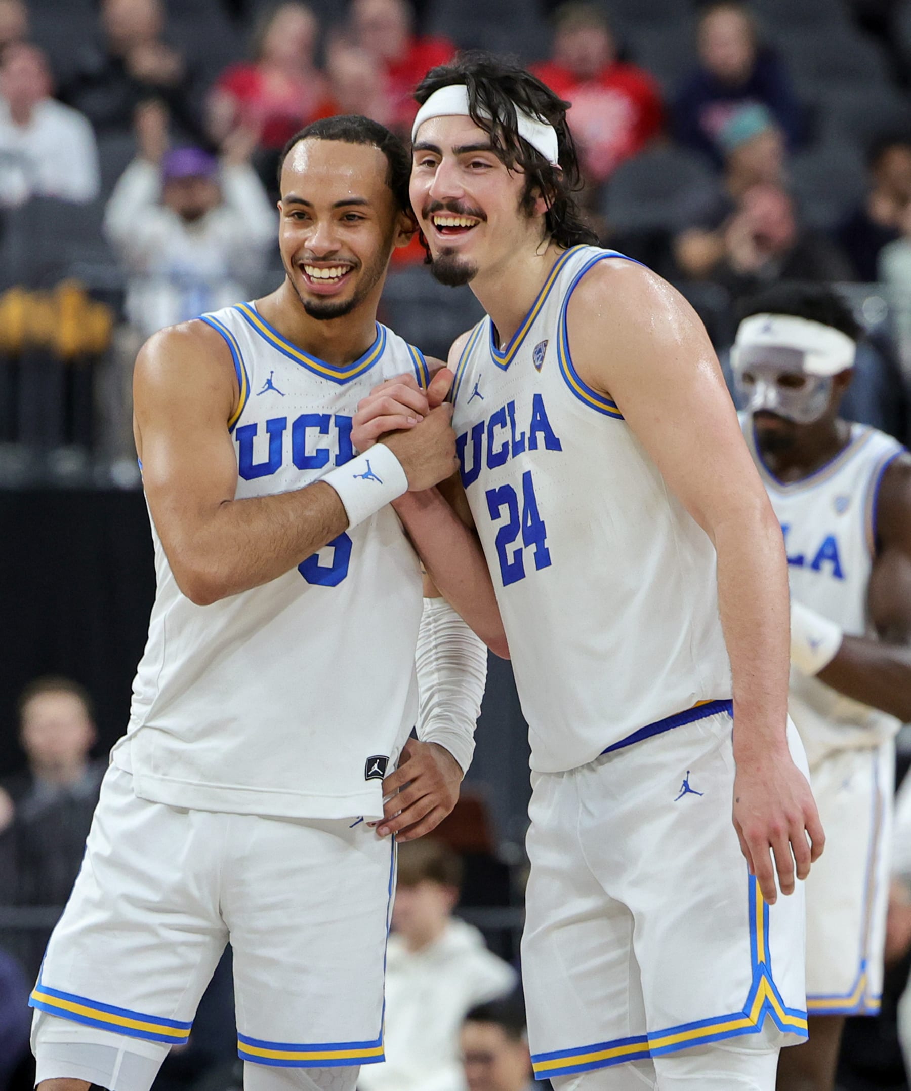 LAS VEGAS, NEVADA - MARCH 09: Amari Bailey #5 and Jaime Jaquez Jr. #24 of the UCLA Bruins celebrate on the court late in the second half of a quarterfinal game of the Pac-12 basketball tournament Colorado Buffaloes at T-Mobile Arena on March 09, 2023 in Las Vegas, Nevada. The Bruins defeated the Buffaloes 80-69. (Photo by Ethan Miller/Getty Images)