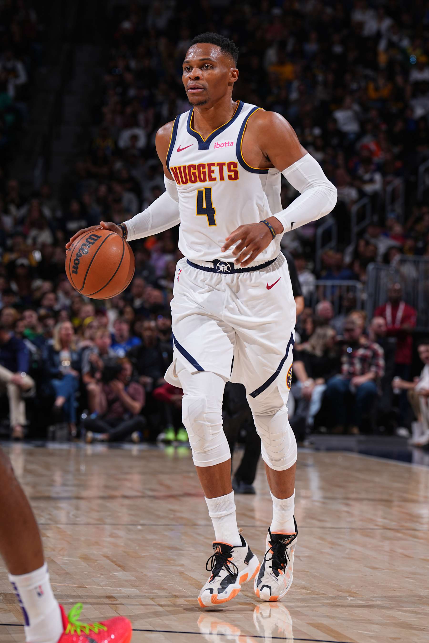 DENVER, CO - OCTOBER 13: Russell Westbrook #4 of the Denver Nuggets dribbles the ball during the game against the Phoenix Suns on October 13, 2024 at Ball Arena in Denver, Colorado. NOTE TO USER: User expressly acknowledges and agrees that, by downloading and/or using this Photograph, user is consenting to the terms and conditions of the Getty Images License Agreement. Mandatory Copyright Notice: Copyright 2024 NBAE (Photo by Garrett Ellwood/NBAE via Getty Images)