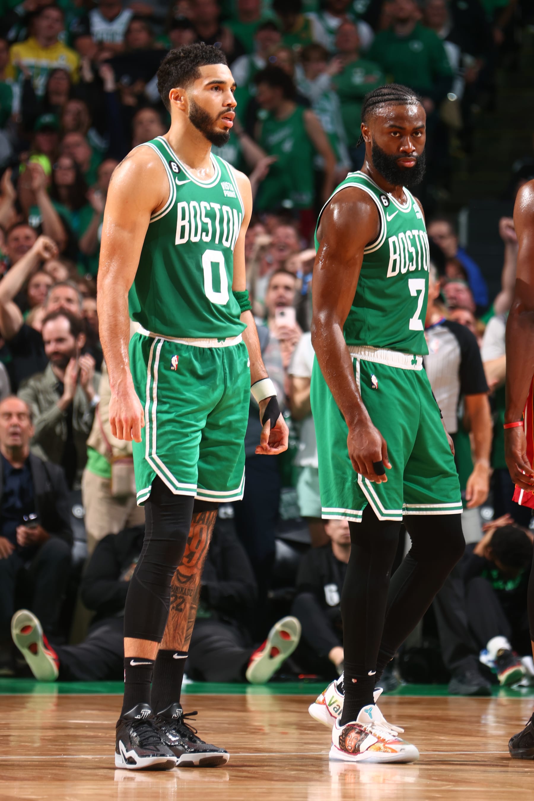 BOSTON, MA - MAY 29: Jaylen Brown #7 and Jayson Tatum #0 of the Boston Celtics look on during round 3 game 7 of the Eastern Conference finals against the Miami Heat on May 29, 2023 at the TD Garden in Boston, Massachusetts. NOTE TO USER: User expressly acknowledges and agrees that, by downloading and or using this photograph, User is consenting to the terms and conditions of the Getty Images License Agreement. Mandatory Copyright Notice: Copyright 2023 NBAE  (Photo by Nathaniel S. Butler/NBAE via Getty Images)