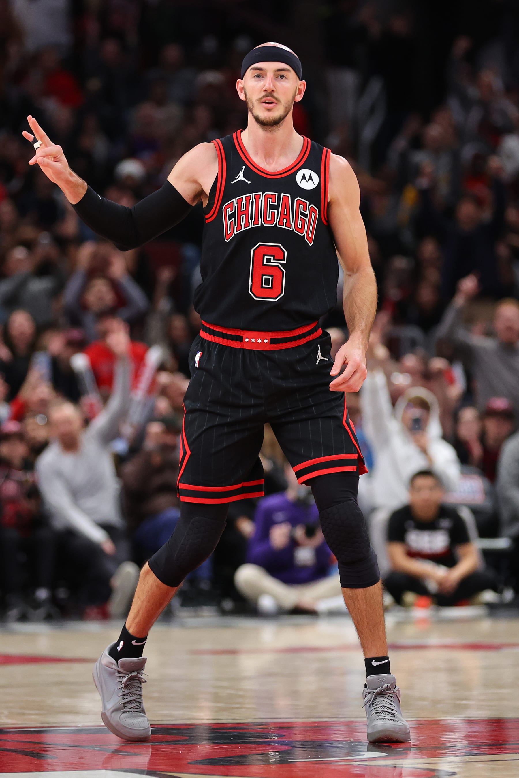 CHICAGO, ILLINOIS - NOVEMBER 08: Alex Caruso #6 of the Chicago Bulls celebrates a three pointer against the Phoenix Suns in overtime at the United Center on November 08, 2023 in Chicago, Illinois. NOTE TO USER: User expressly acknowledges and agrees that, by downloading and or using this photograph, User is consenting to the terms and conditions of the Getty Images License Agreement.  (Photo by Michael Reaves/Getty Images)
