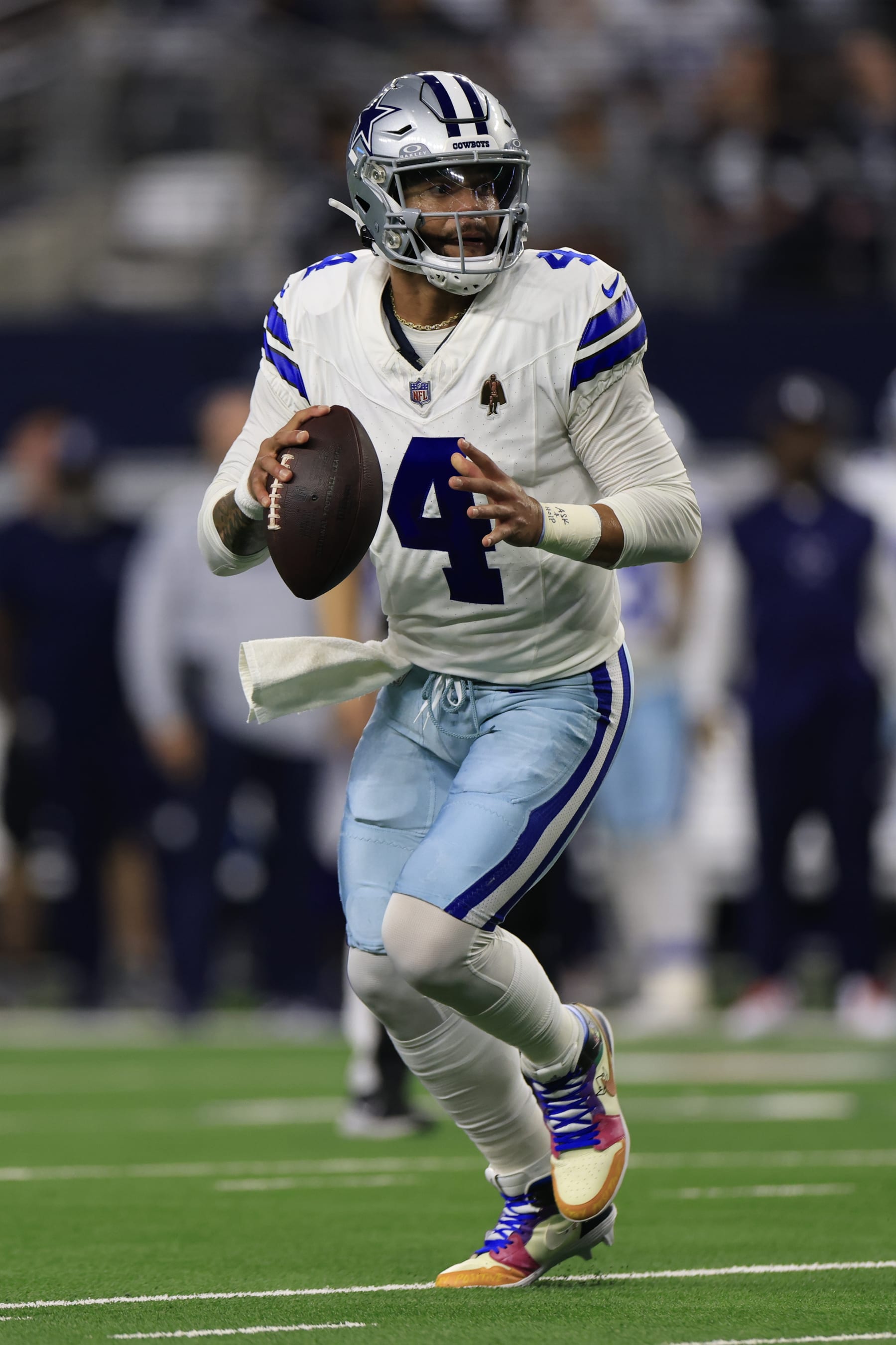 ARLINGTON, TEXAS - NOVEMBER 30: Quarterback Dak Prescott #4 of the Dallas Cowboys scrambles during the first quarter of the game against the Seattle Seahawks at AT&T Stadium on November 30, 2023 in Arlington, Texas. (Photo by Ron Jenkins/Getty Images)