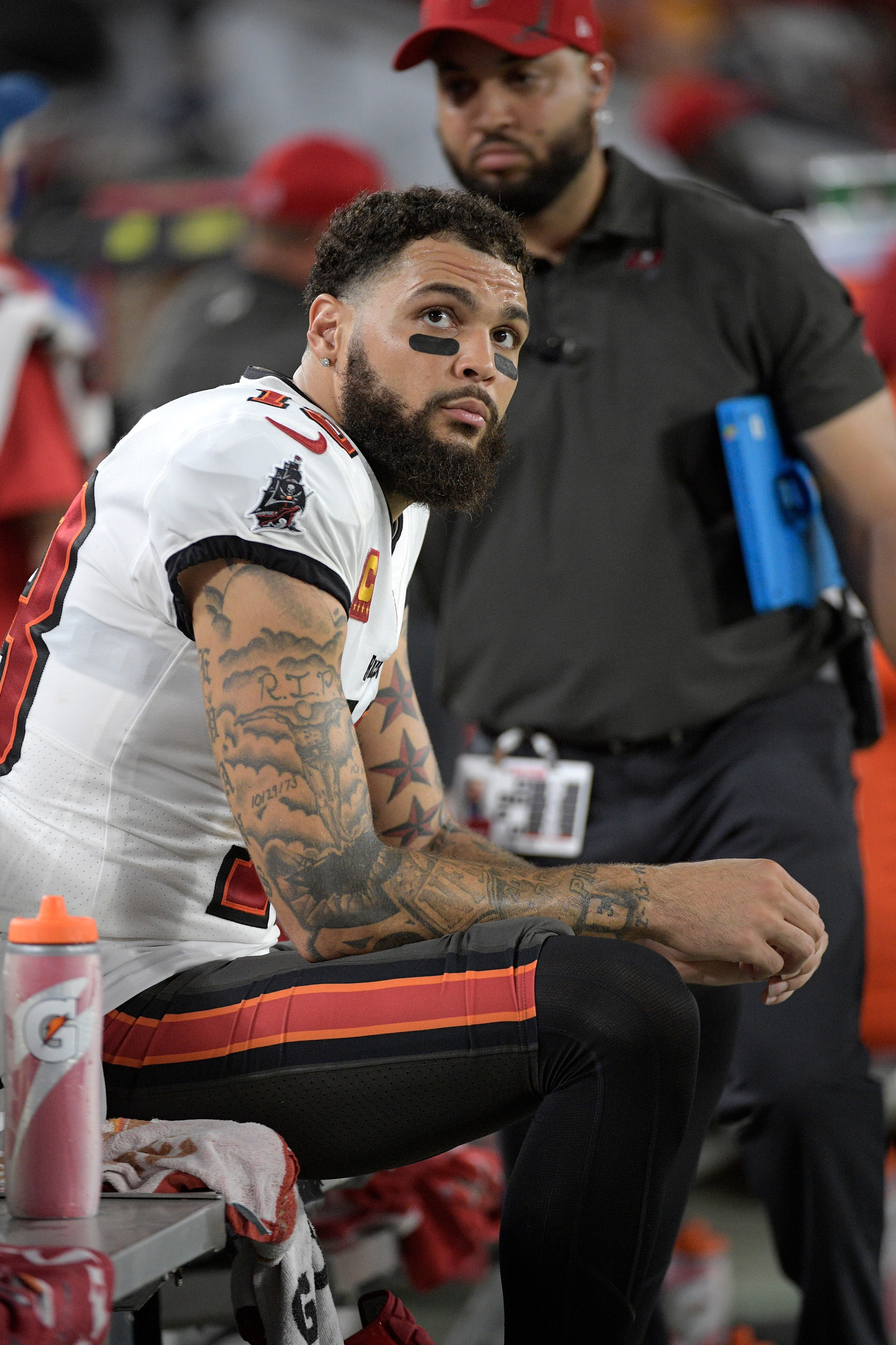 Tampa Bay Buccaneers wide receiver Mike Evans (13) watches from the bench during the first half of an NFL football game against the Dallas Cowboys, Thursday, Sept. 9, 2021, in Tampa, Fla. (AP Photo/Phelan M. Ebenhack)