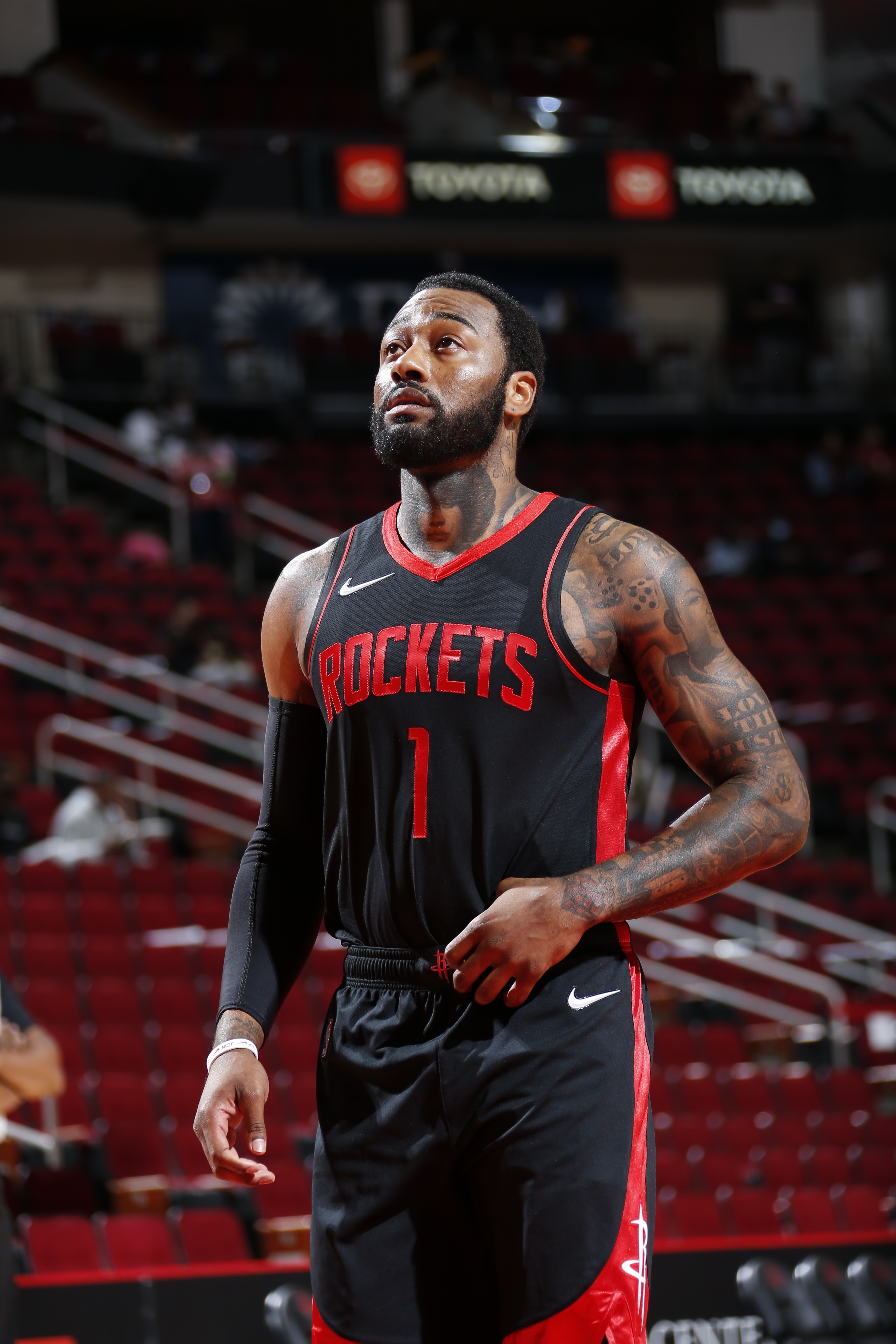 HOUSTON, TX - APRIL 23: John Wall #1 of the Houston Rockets looks on before the game against the Los Angeles Clippers on April 23, 2021 at the Toyota Center in Houston, Texas. NOTE TO USER: User expressly acknowledges and agrees that, by downloading and or using this photograph, User is consenting to the terms and conditions of the Getty Images License Agreement. Mandatory Copyright Notice: Copyright 2021 NBAE (Photo by Troy Fields/NBAE via Getty Images)