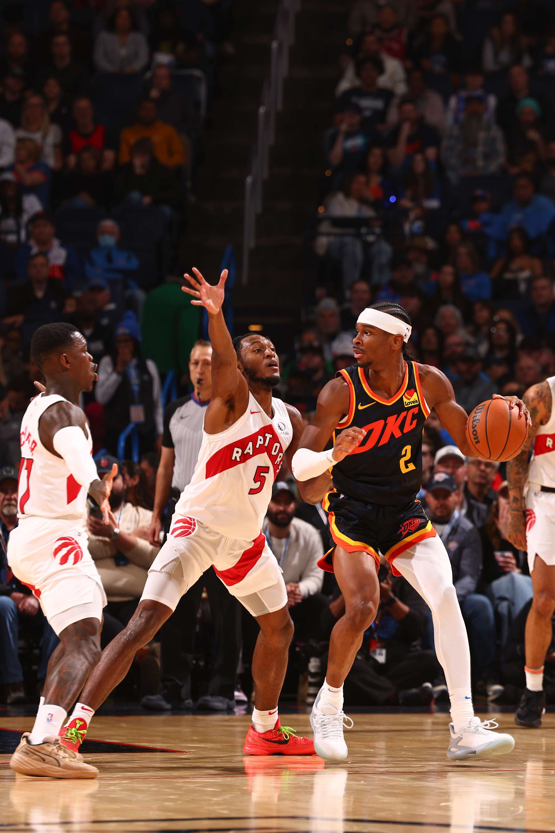 OKLAHOMA CITY, OK - FEBRUARY 4:  Immanuel Quickley #5 of the Toronto Raptors plays defense during the game  against Shai Gilgeous-Alexander #2 of the Oklahoma City Thunder on February 4, 2024 at Paycom Arena in Oklahoma City, Oklahoma. NOTE TO USER: User expressly acknowledges and agrees that, by downloading and or using this photograph, User is consenting to the terms and conditions of the Getty Images License Agreement. Mandatory Copyright Notice: Copyright 2024 NBAE (Photo by Zach Beeker/NBAE via Getty Images)