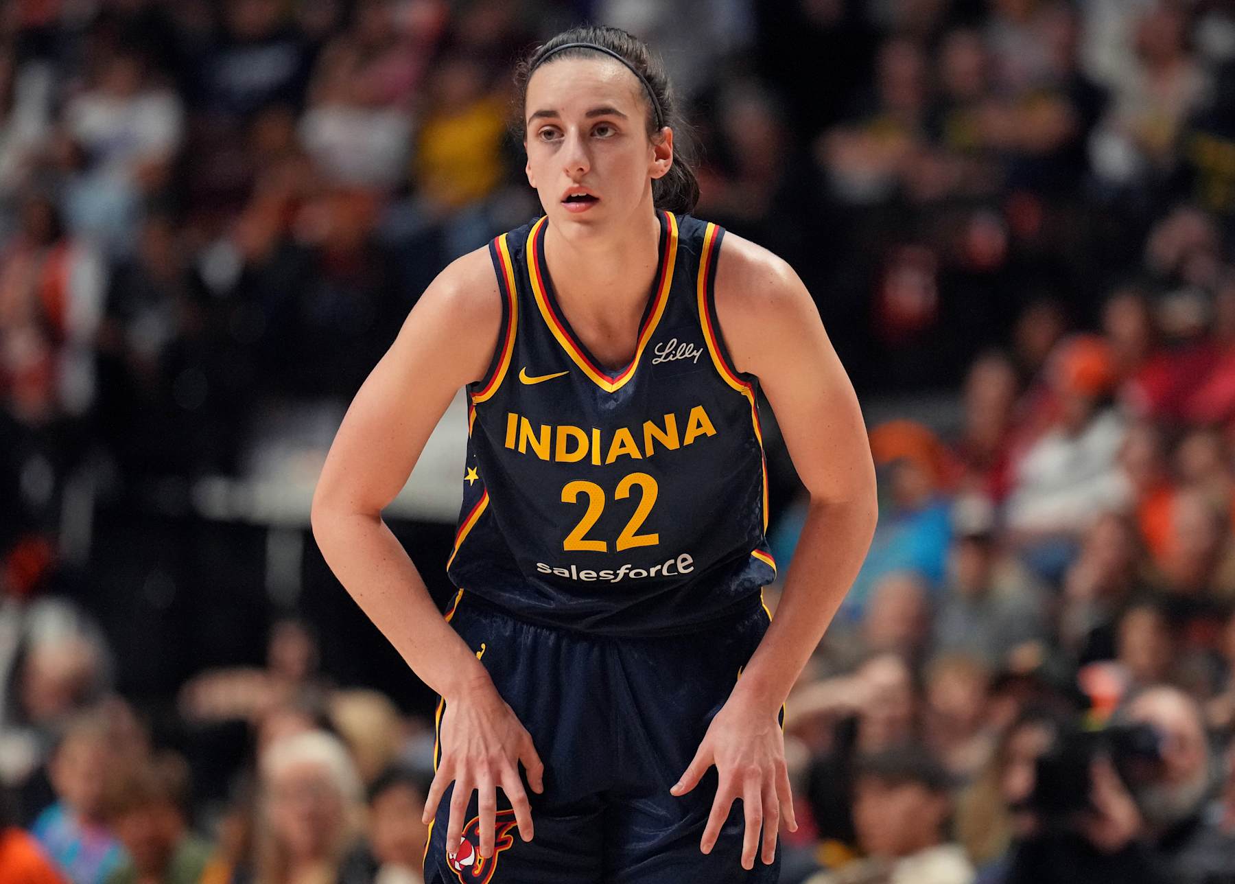 UNCASVILLE, CT - SEPTEMBER 22: Caitlin Clark #22 of the Indiana Fever looks on during the game against the Connecticut Sun during round one game one of the 2024 WNBA Playoffs on September 22, 2024 at the Mohegan Sun Arena in Uncasville, Connecticut. NOTE TO USER: User expressly acknowledges and agrees that, by downloading and or using this photograph, User is consenting to the terms and conditions of the Getty Images License Agreement. Mandatory Copyright Notice: Copyright 2024 NBAE (Photo by Jesse D. Garrabrant/NBAE via Getty Images)