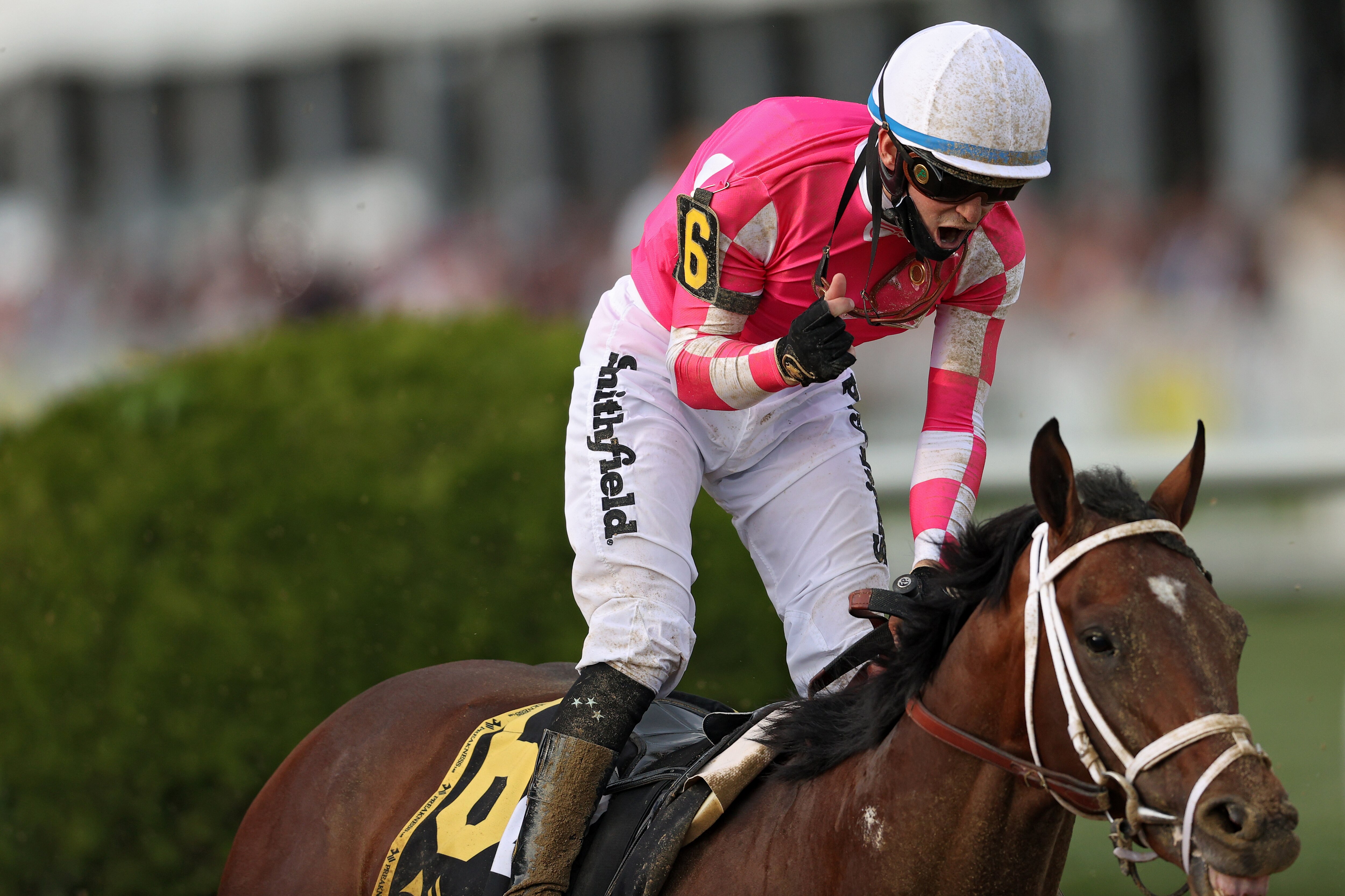 BALTIMORE, MARYLAND - MAY 15: Jockey Flavien Prat #6 riding Rombauer celebrates as he wins the 146th Running of the Preakness Stakes at Pimlico Race Course on May 15, 2021 in Baltimore, Maryland. (Photo by Patrick Smith/Getty Images)