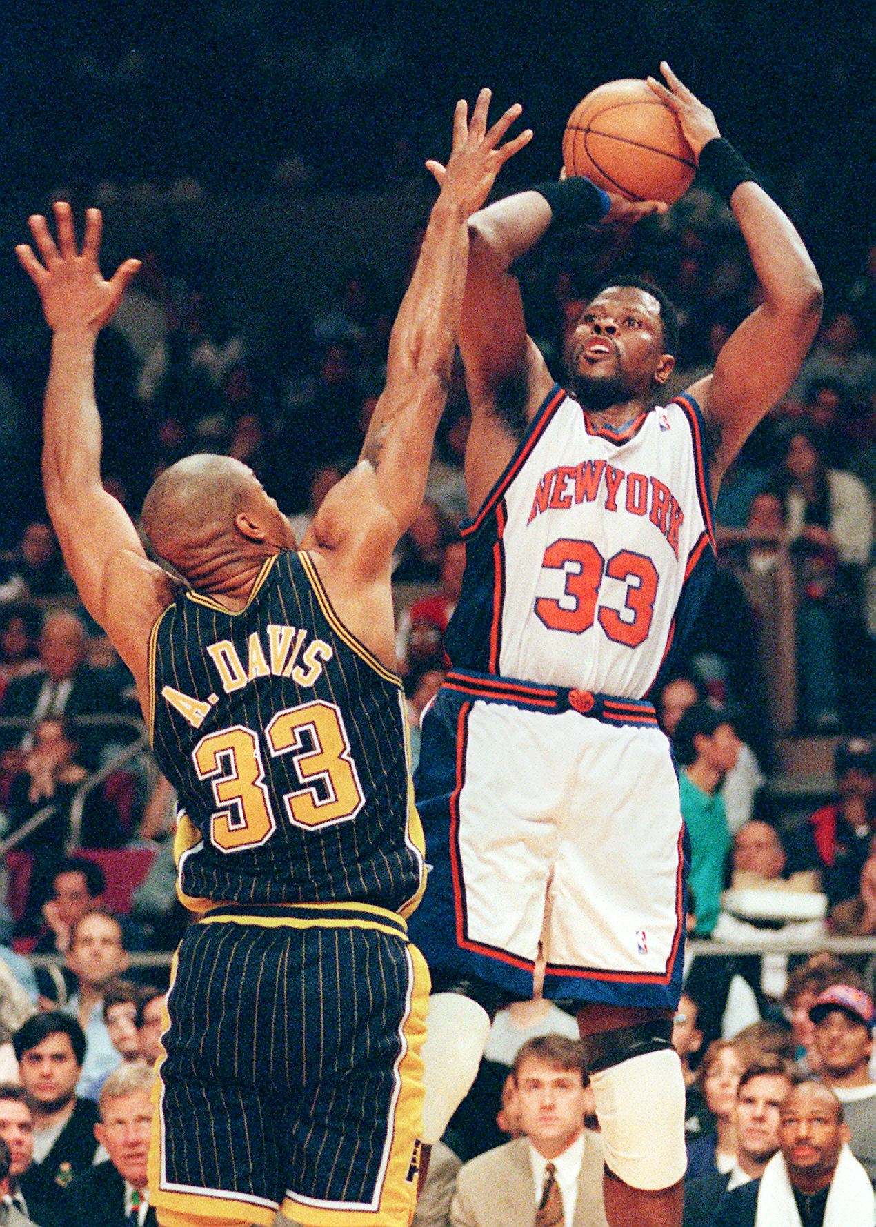 NEW YORK, UNITED STATES:  New York Knicks Patrick Ewing (R) shoots over Antonio Davis of the Indiana Pacers (L) during the third quarter of the NBA Eastern Conference semi-finals at Madison Square Garden 09 May in New Yok. Ewing had 19 points to lead the Knicks to an 83-76 win. Pacers lead the series, 2-1.   AFP  PHOTO   Stan HONDA (Photo credit should read STAN HONDA/AFP via Getty Images)