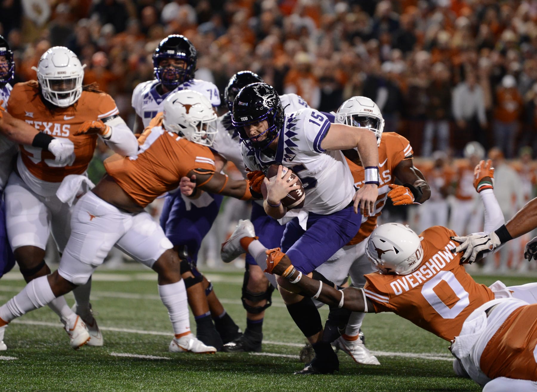 AUSTIN, TX - NOVEMBER 12: TCU Horned Frogs QB Max Duggan (15) is sacked by Texas Longhorns DB De'Marvion Overshown (0) during Big 12 football game between the TCU Horned Frogs and the Texas Longhorns on November 12, 2022 at Darrell K Royal - Texas Memorial Stadium in Austin, TX. (Photo by John Rivera/Icon Sportswire via Getty Images)