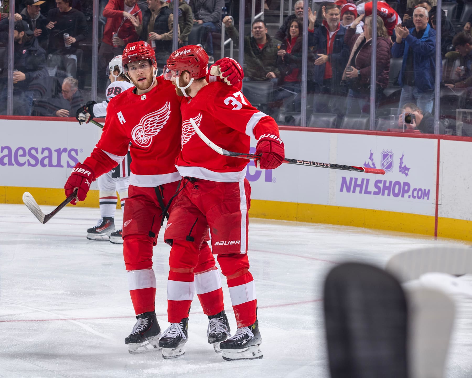 DETROIT, MI - NOVEMBER 30: J.T. Compher #37 of the Detroit Red Wings celebrates his goal against the Chicago Blackhawks with teammate Andrew Copp #18 during the first period at Little Caesars Arena on November 30, 2023 in Detroit, Michigan. (Photo by Dave Reginek/NHLI via Getty Images)
